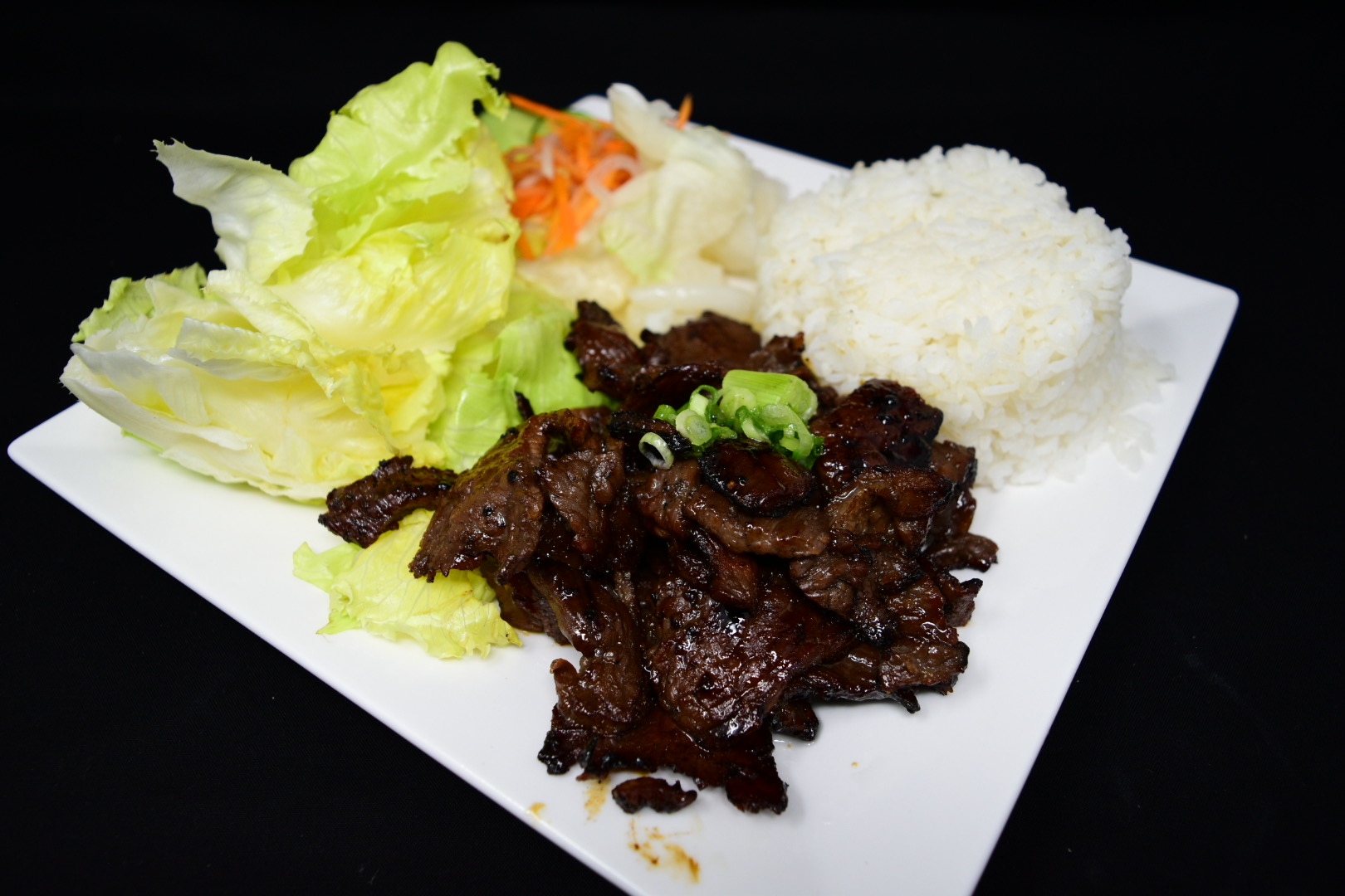 Order 63. Com Bo Nuong Xa/Flame Broiled Beef with lemongrass food online from Fortune Star Cuisine store, Reno on bringmethat.com