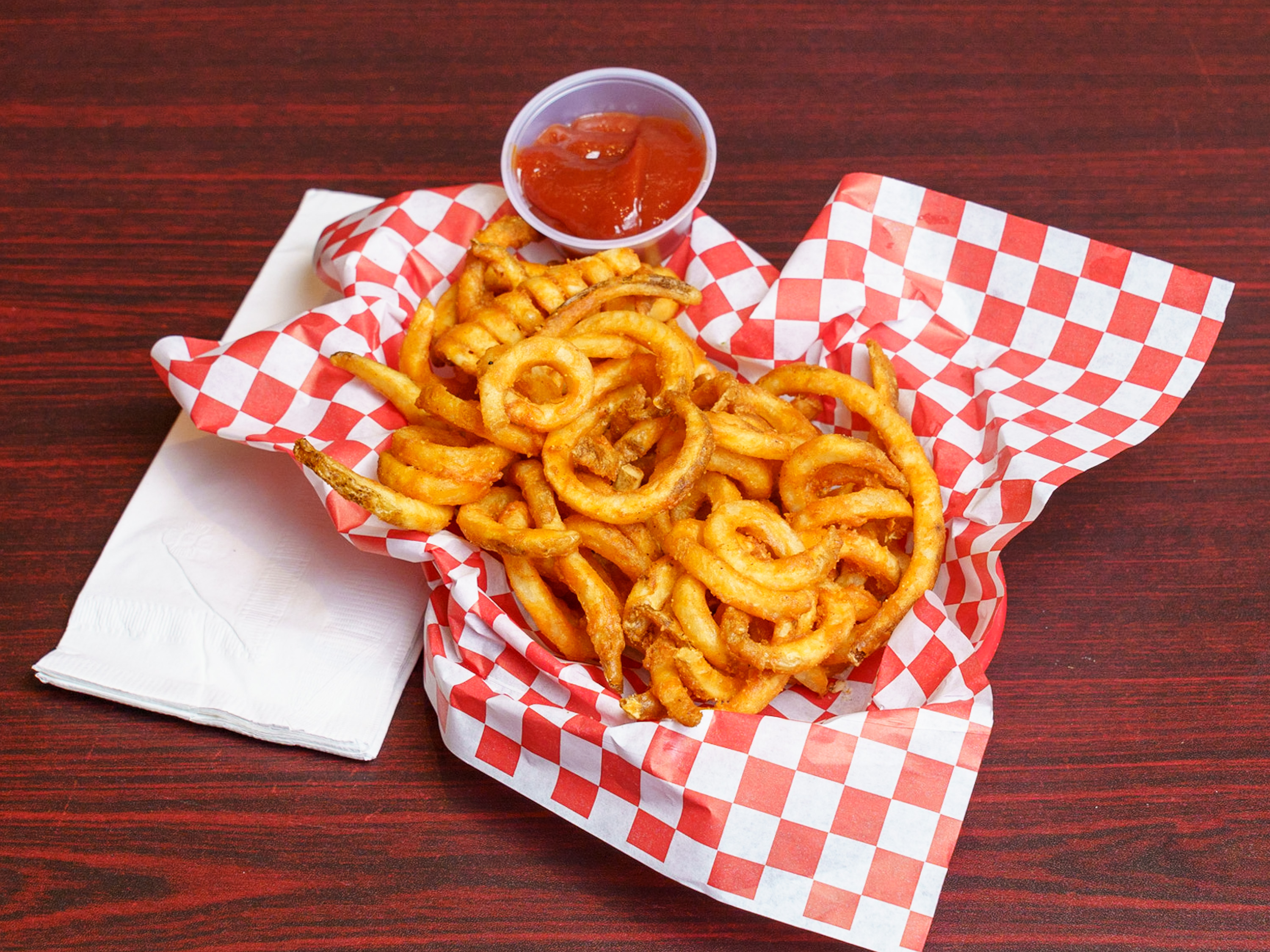 Order Curly Fries food online from Sassy Wings store, San Francisco on bringmethat.com