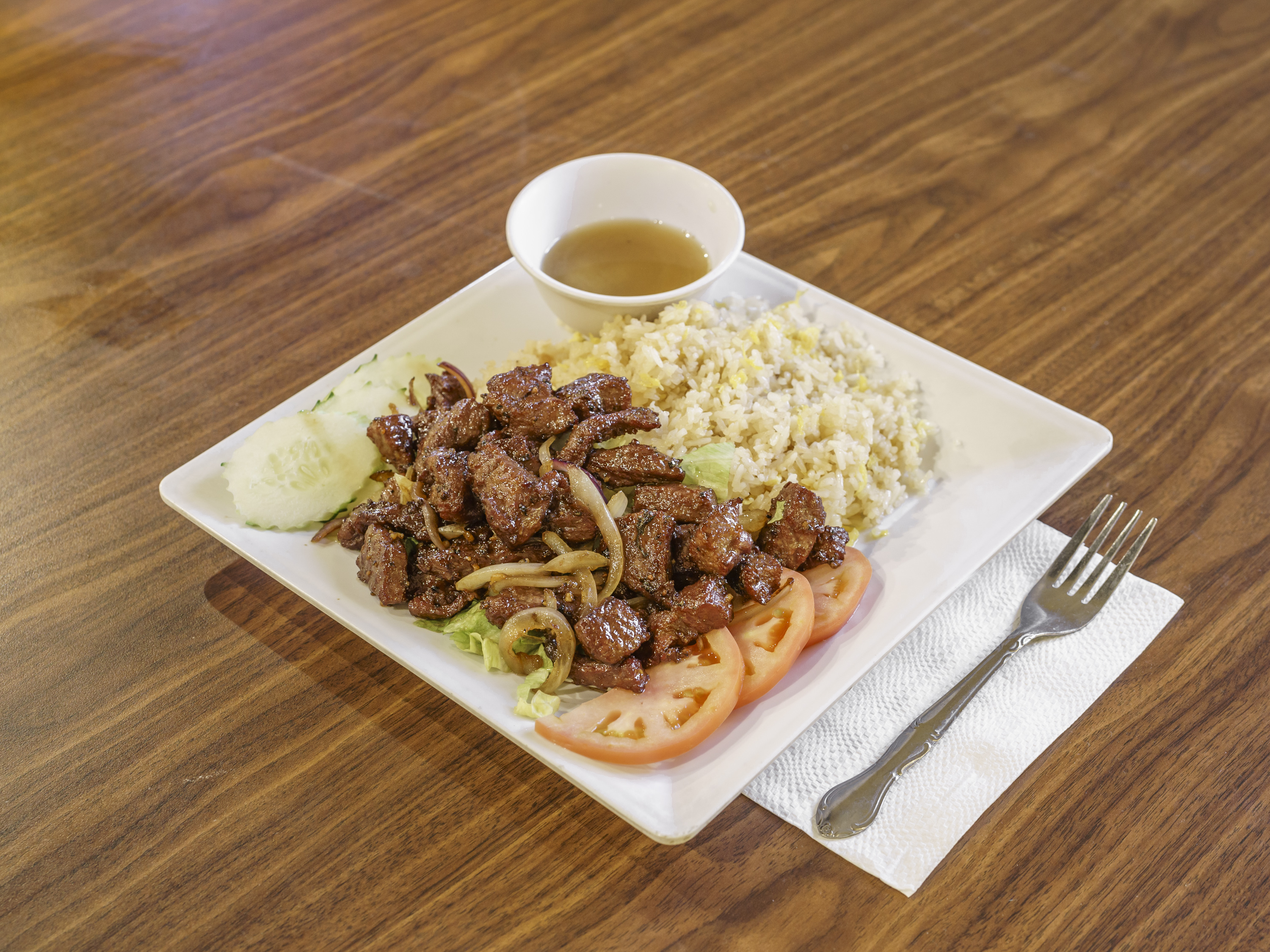 Order 35. Beef Lok Lak on Steamed Rice food online from Hak Heang Restaurant store, Long Beach on bringmethat.com