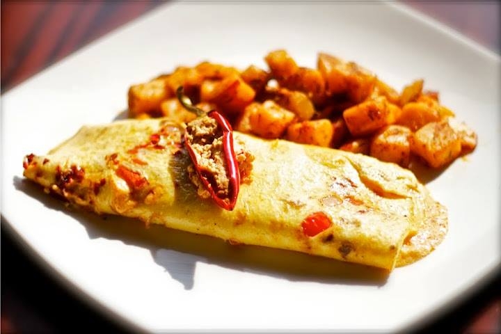 Order Spicy Feta Omelette food online from Kanela Breakfast Club store, Chicago on bringmethat.com