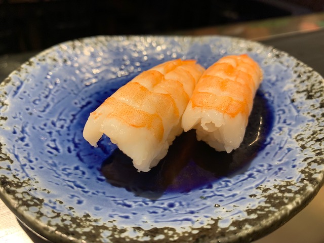 Order Ebi Nigiri food online from Blue Fin Sushi store, San Francisco on bringmethat.com