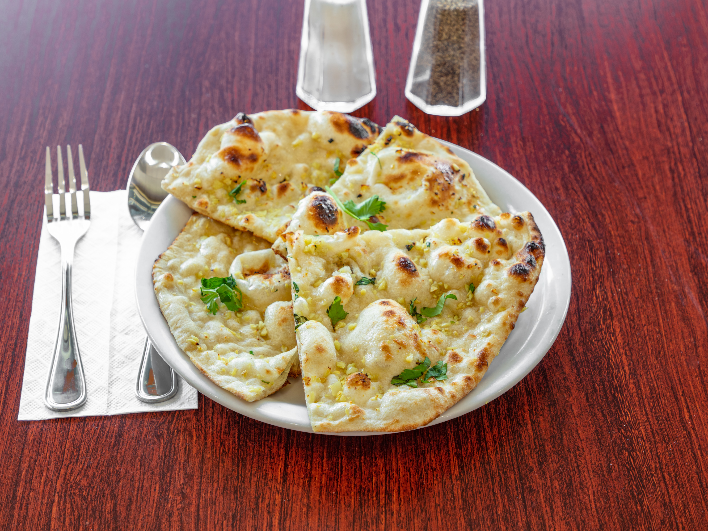 Order Garlic Naan food online from Chameli Restaurant store, Richardson on bringmethat.com
