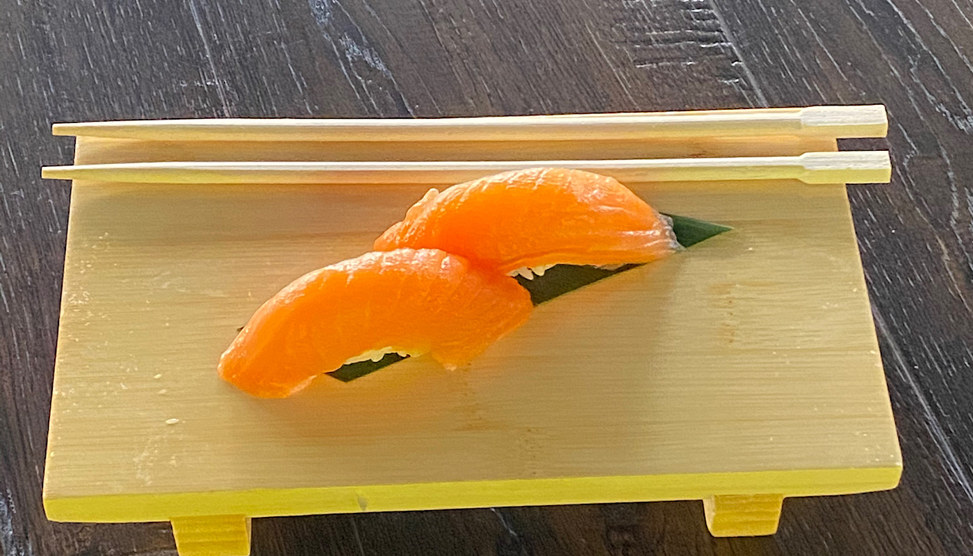 Order Salmon Nigiri - 2 Pieces food online from Sushi Train store, Minneapolis on bringmethat.com
