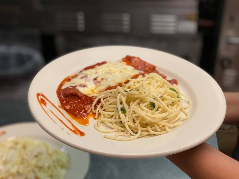 Order Chicken Parmigiana Dinner - Entree food online from Mia's Pizzeria & Restaurant store, Plainview on bringmethat.com