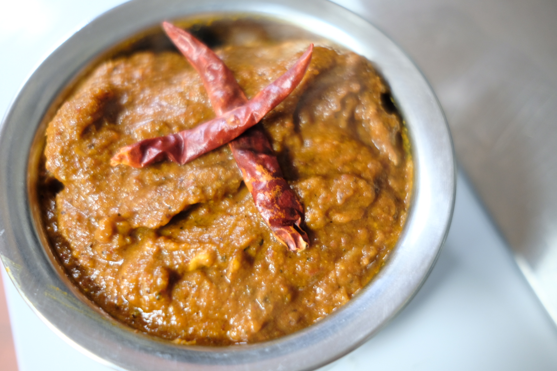 Order Lamb Vindaloo(very spicy) food online from Sathi Indian Restaurant store, New York on bringmethat.com
