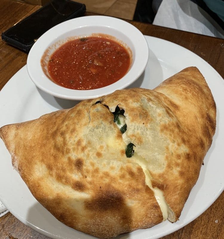 Order Spinach Calzone - Calzone food online from Fiore Pizzeria & Restaurant store, Old Saybrook on bringmethat.com