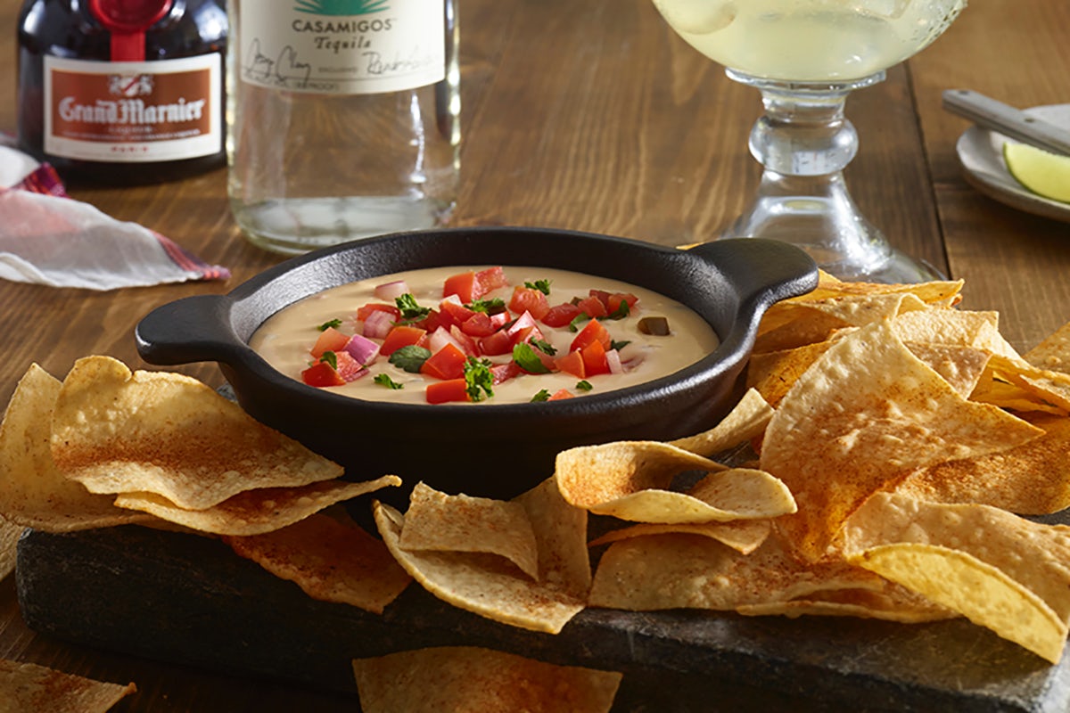 Order Cheddar Cheese Queso & Chips food online from Ruby Tuesday store, Charlotte on bringmethat.com
