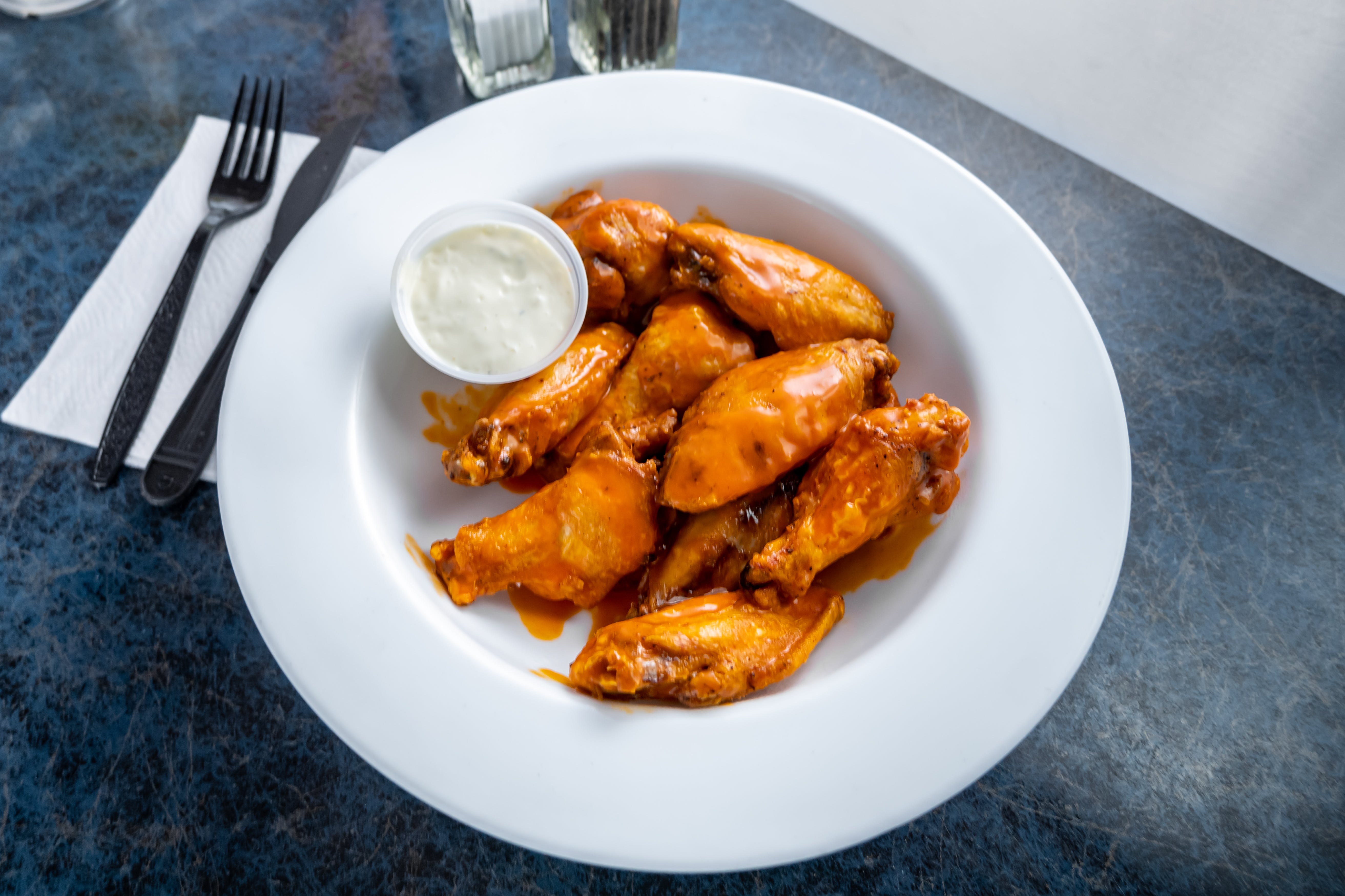 Order Bone In Wings - 1 lb. (10 Pieces) food online from Marzella's Pizza store, Collegeville on bringmethat.com
