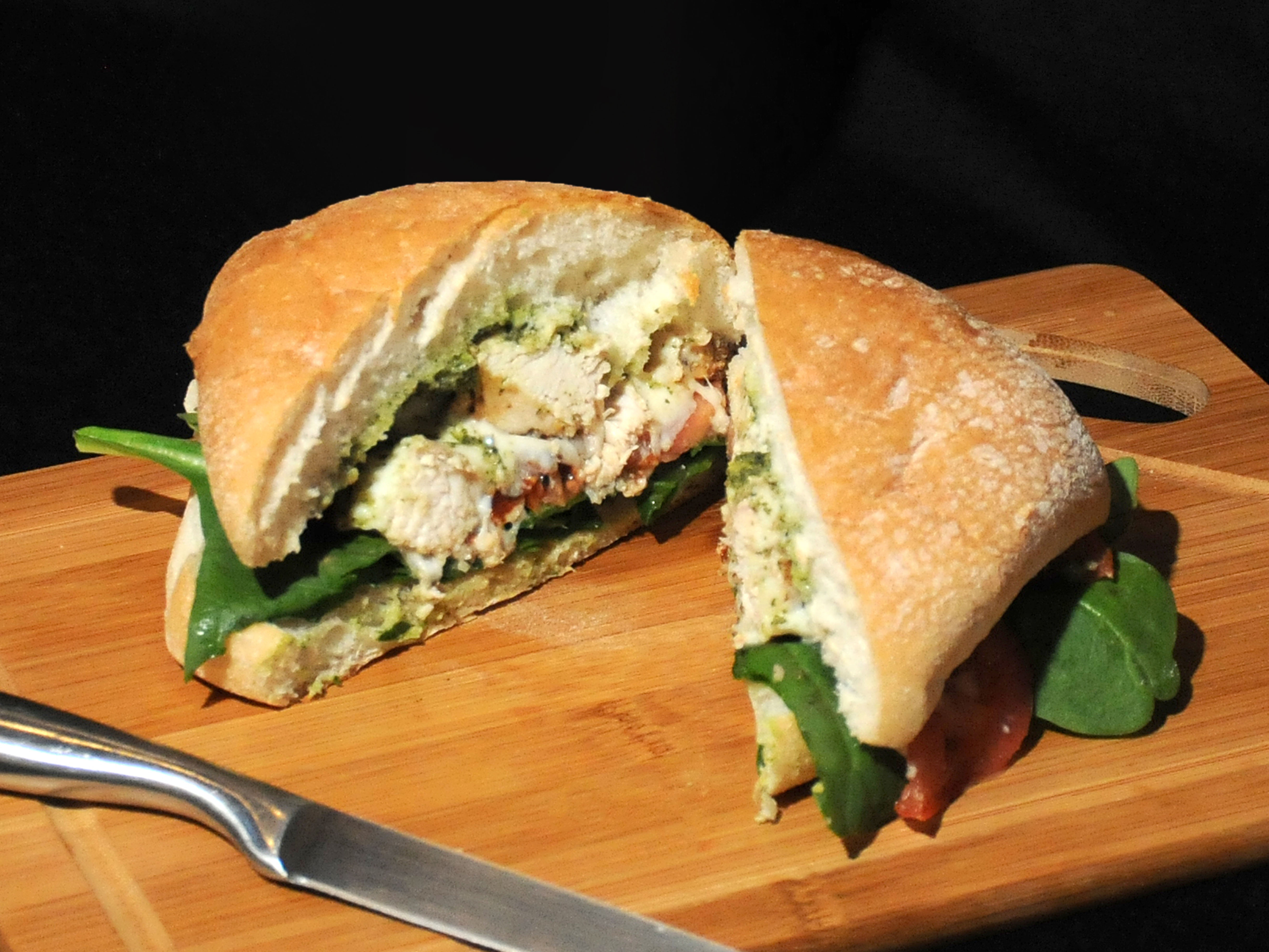 Order Chicken Pesto Sandwich with Choice of Side food online from One More Bite store, Cedar Rapids on bringmethat.com