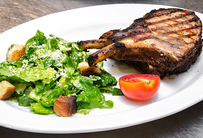 Order Roasted Pork Chop food online from Cork And Pig Tavern store, San Angelo on bringmethat.com