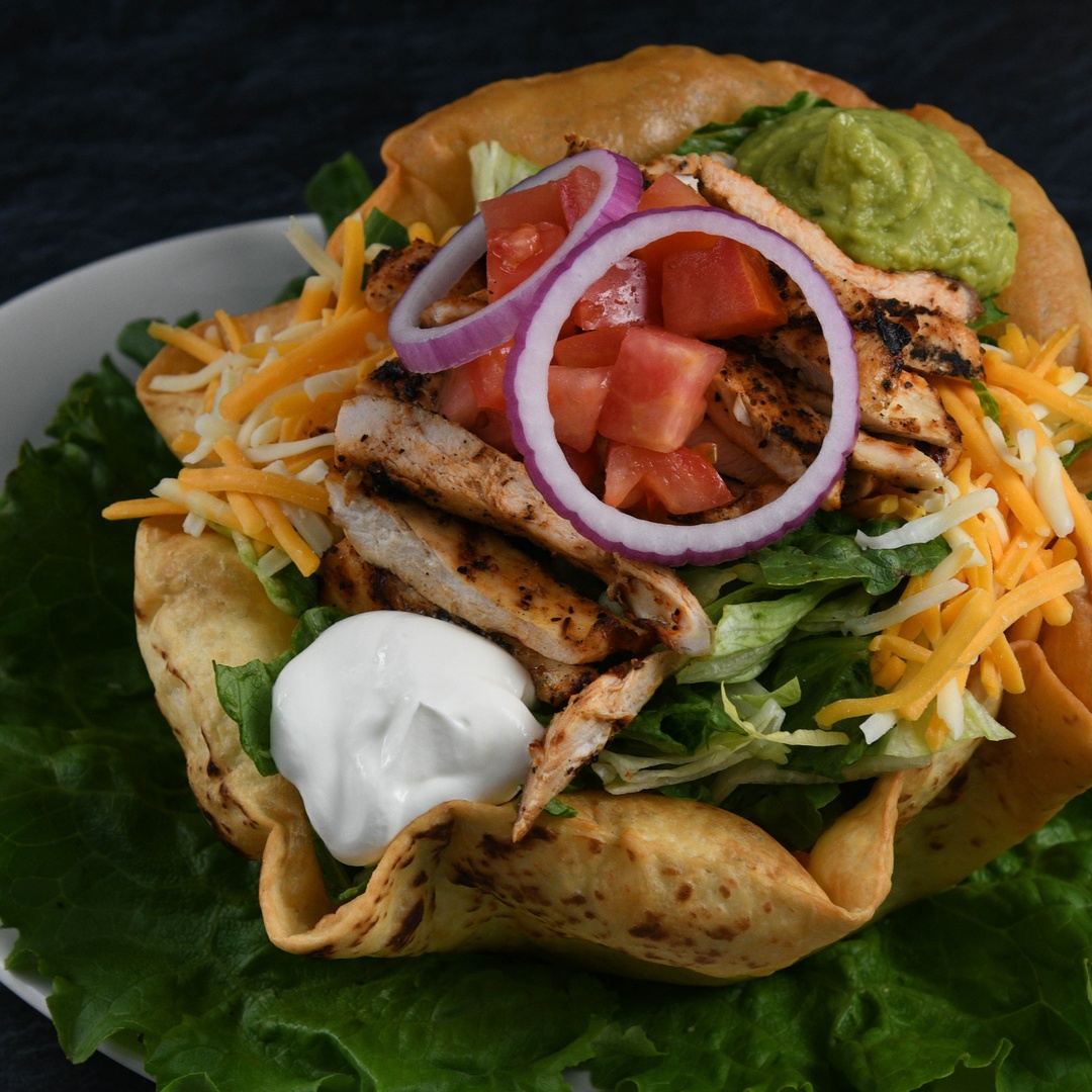 Order Taco Salad Chicken food online from Rainforest Cafe store, Las Vegas on bringmethat.com