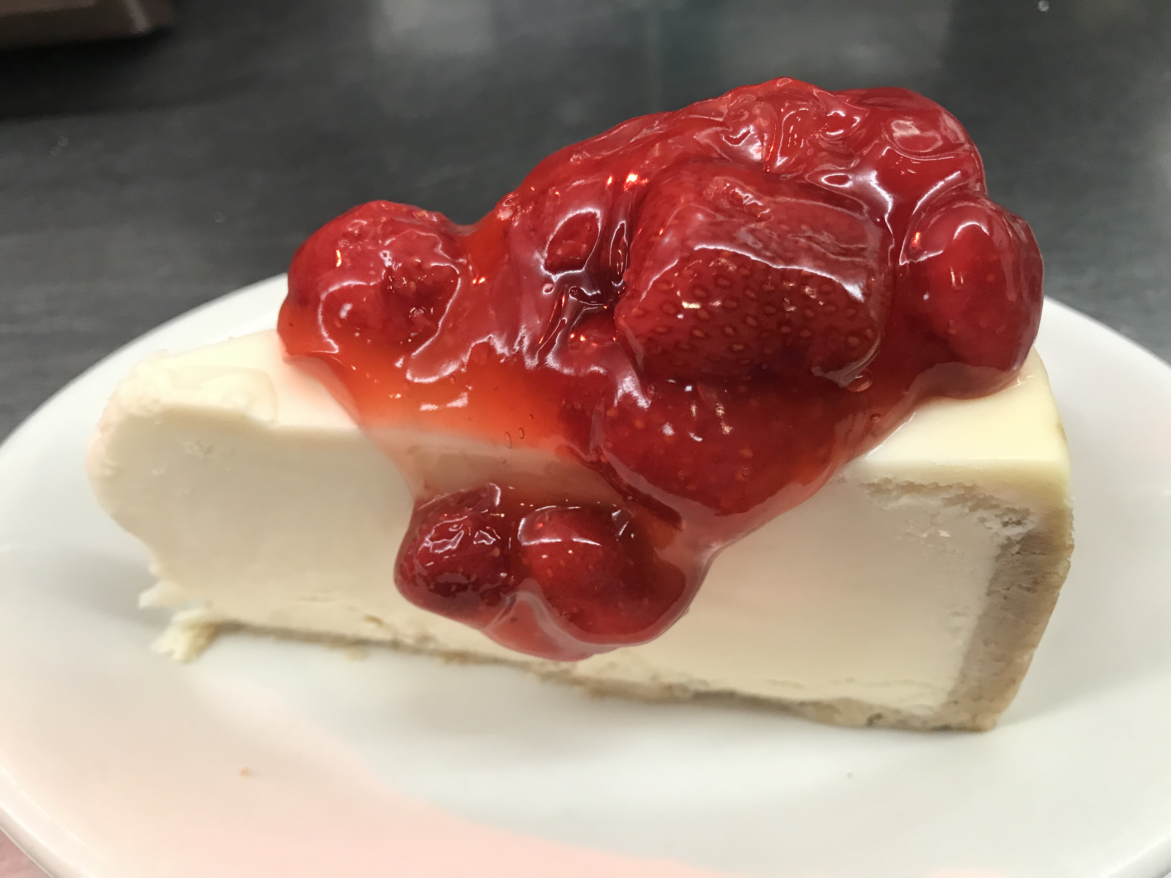 Order NY Style Cheesecake with Strawberry Topping food online from Eastridge Family Restaurant store, Rochester on bringmethat.com