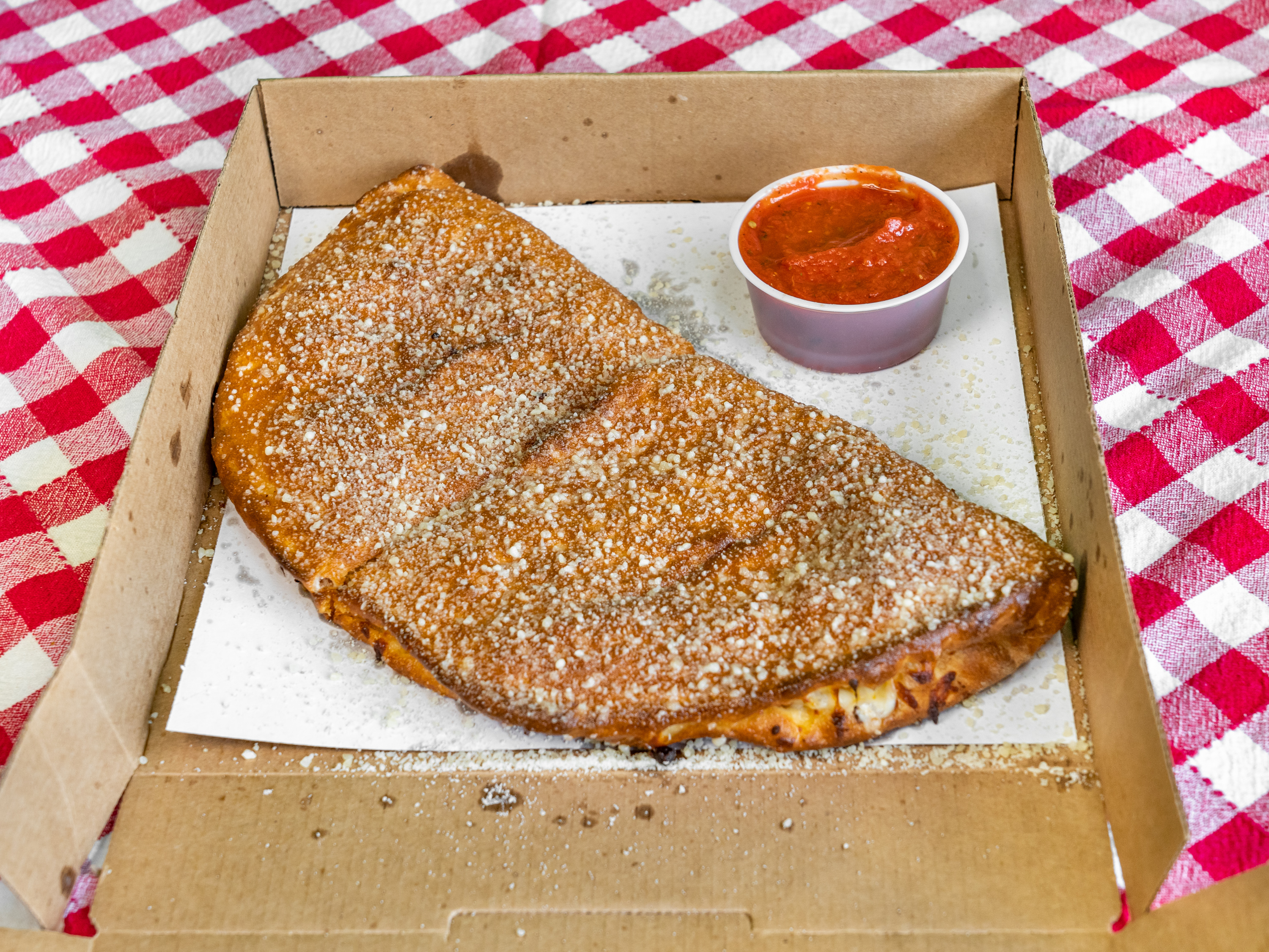 Order Philly Cheesesteak Calzone food online from What Up Dough Pizzeria store, Utica on bringmethat.com