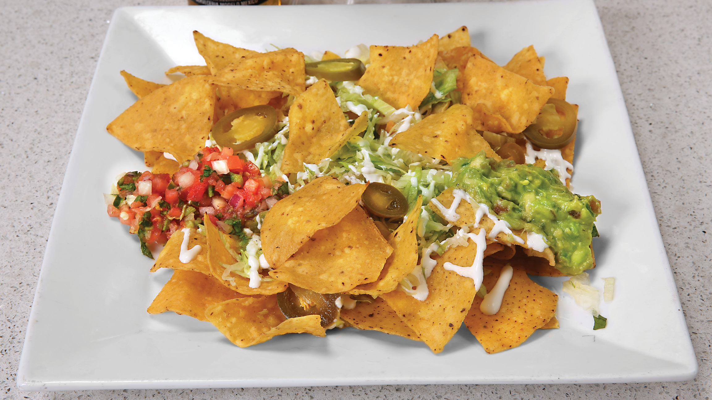 Order Nachos food online from Brothers Mexican Grill store, La Grange on bringmethat.com