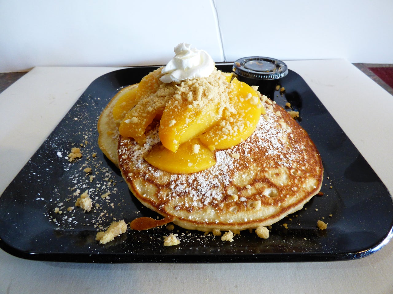 Order Peach Cobbler Pancakes Breakfast food online from Downtown Chandler Cafe And Bakery store, Chandler on bringmethat.com