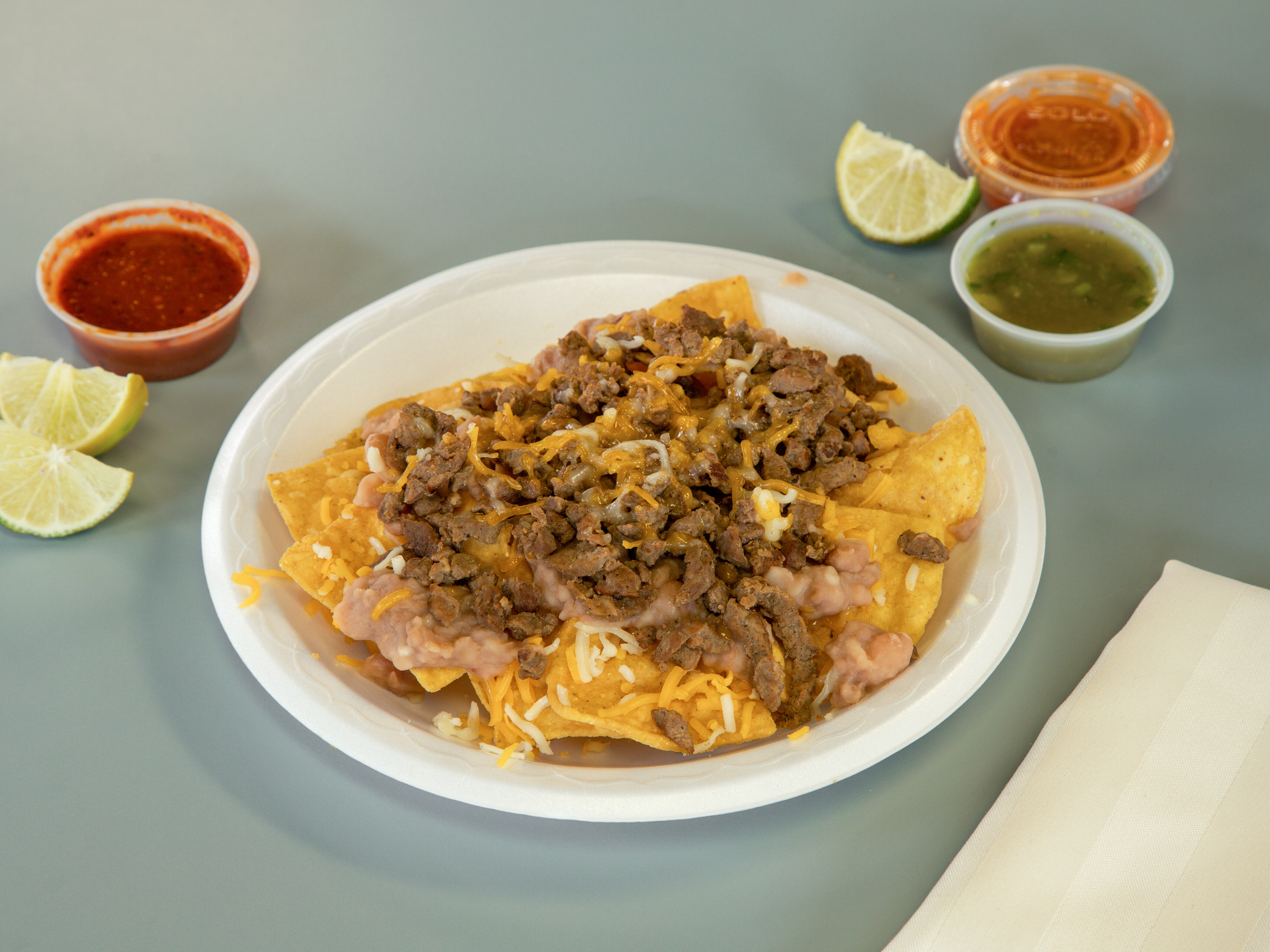 Order Mini Nachos (includes small drink) food online from Aldertos Fresh Mexican Food store, Reno on bringmethat.com