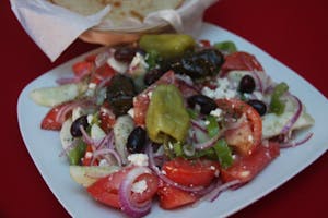 Order Horiatiki Salata food online from Zorbas Fine Greek Cuisine store, Albuquerque on bringmethat.com