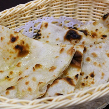 Order Butter Naan food online from Roti House store, Jersey City on bringmethat.com
