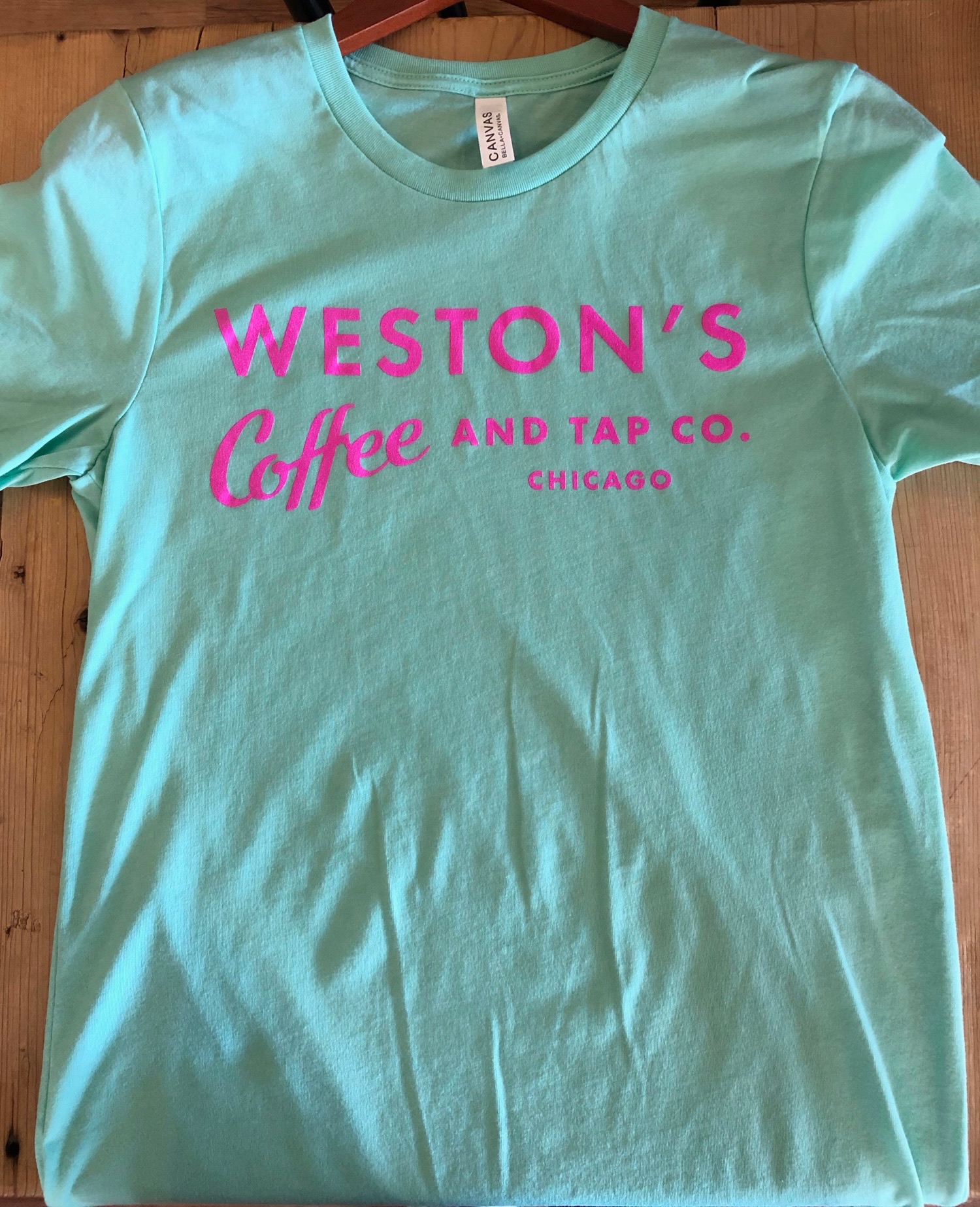 Order Mint Green T-Shirt (Unisex) food online from Weston's Coffee & Tap Co. store, Chicago on bringmethat.com