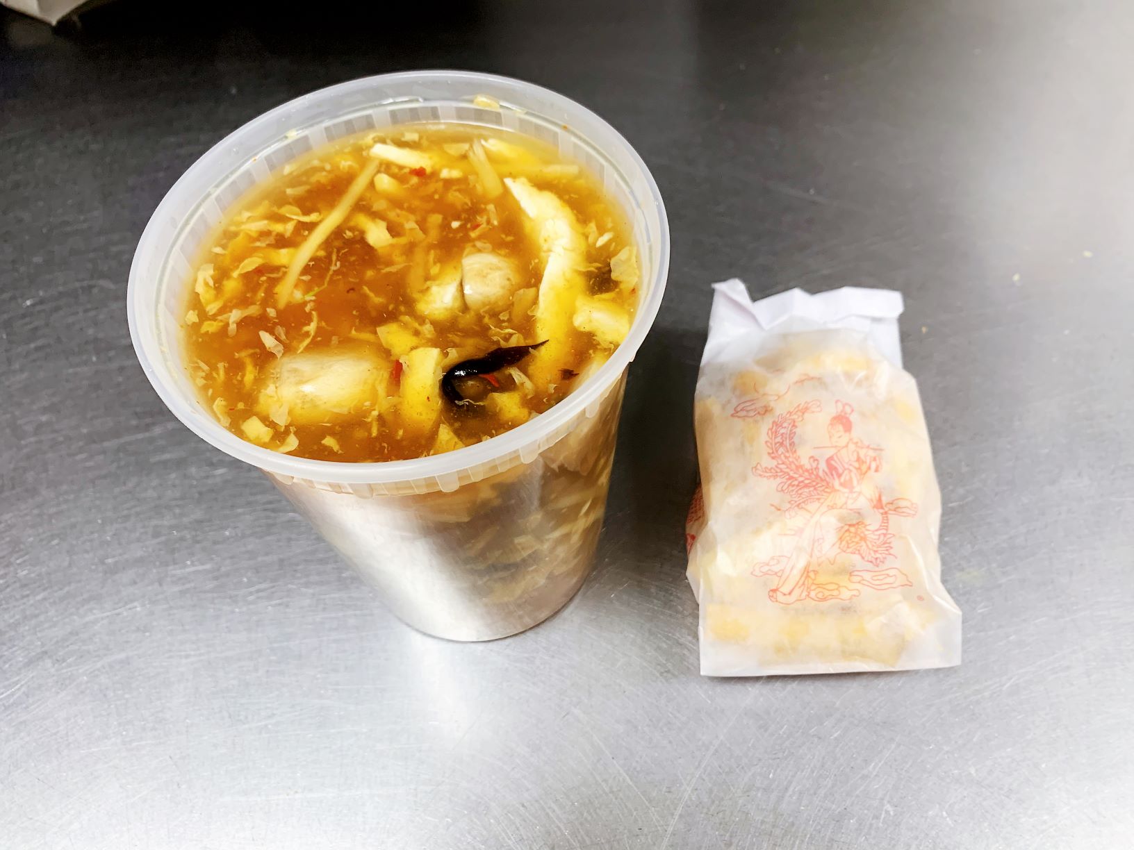 Order Hot Sour Soup food online from New China store, Cary on bringmethat.com