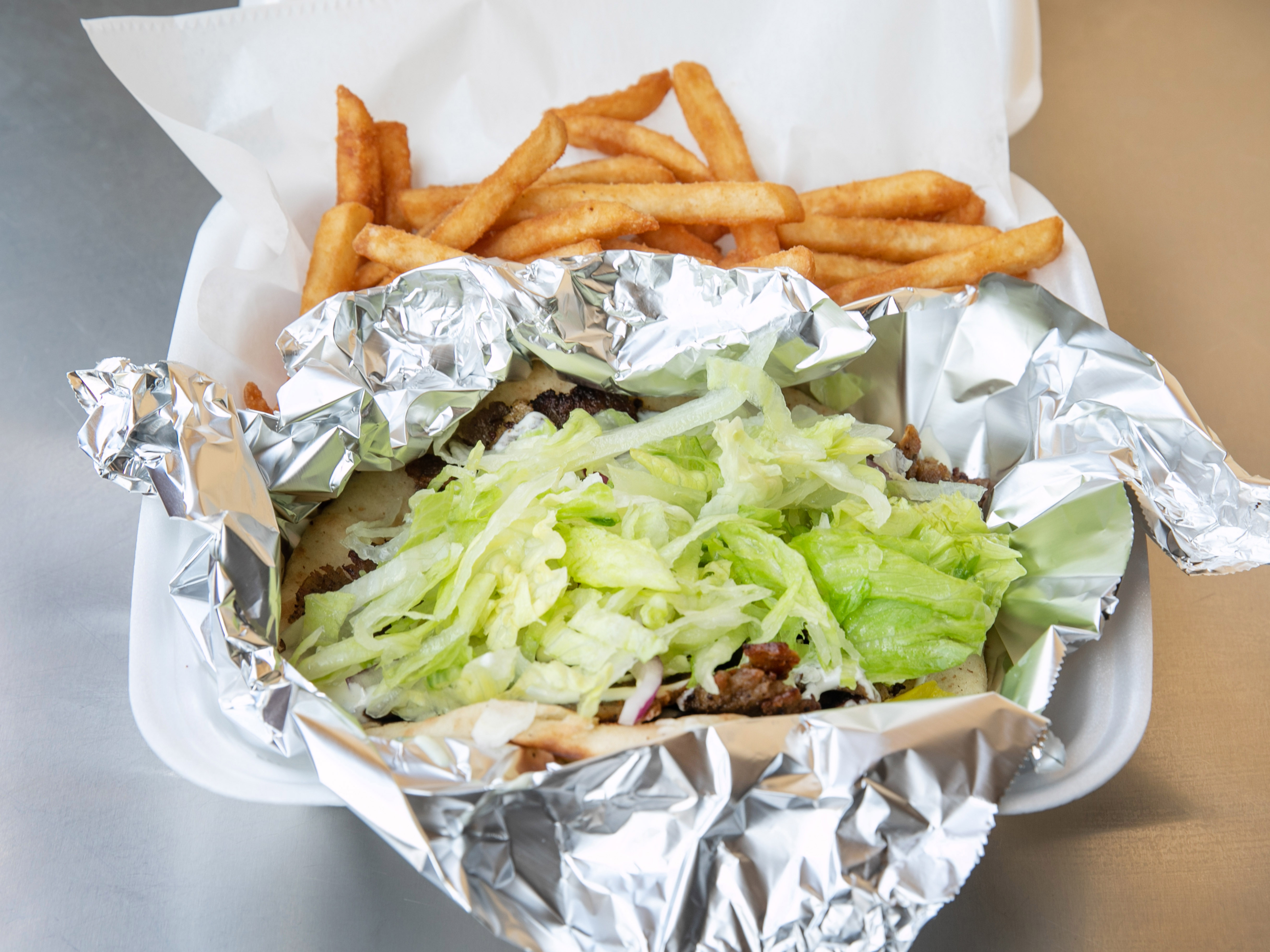 Order Gyro food online from Tito's Pizza store, Columbus on bringmethat.com