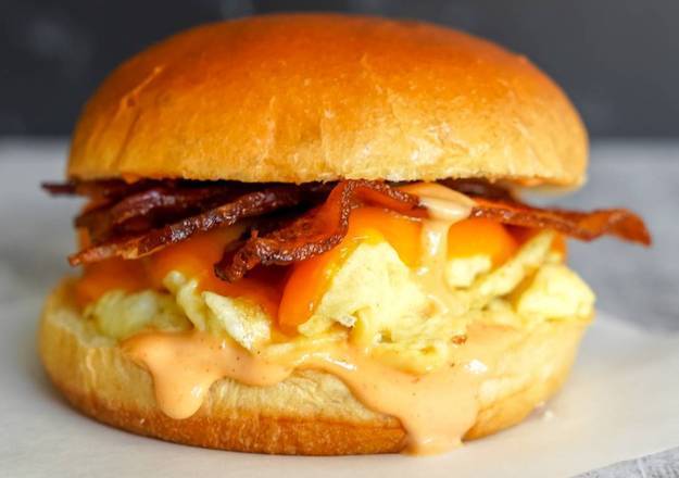 Order Brioche/Croissant, Bacon, Egg, & Cheddar food online from Breakfast in Bed store, Troy on bringmethat.com