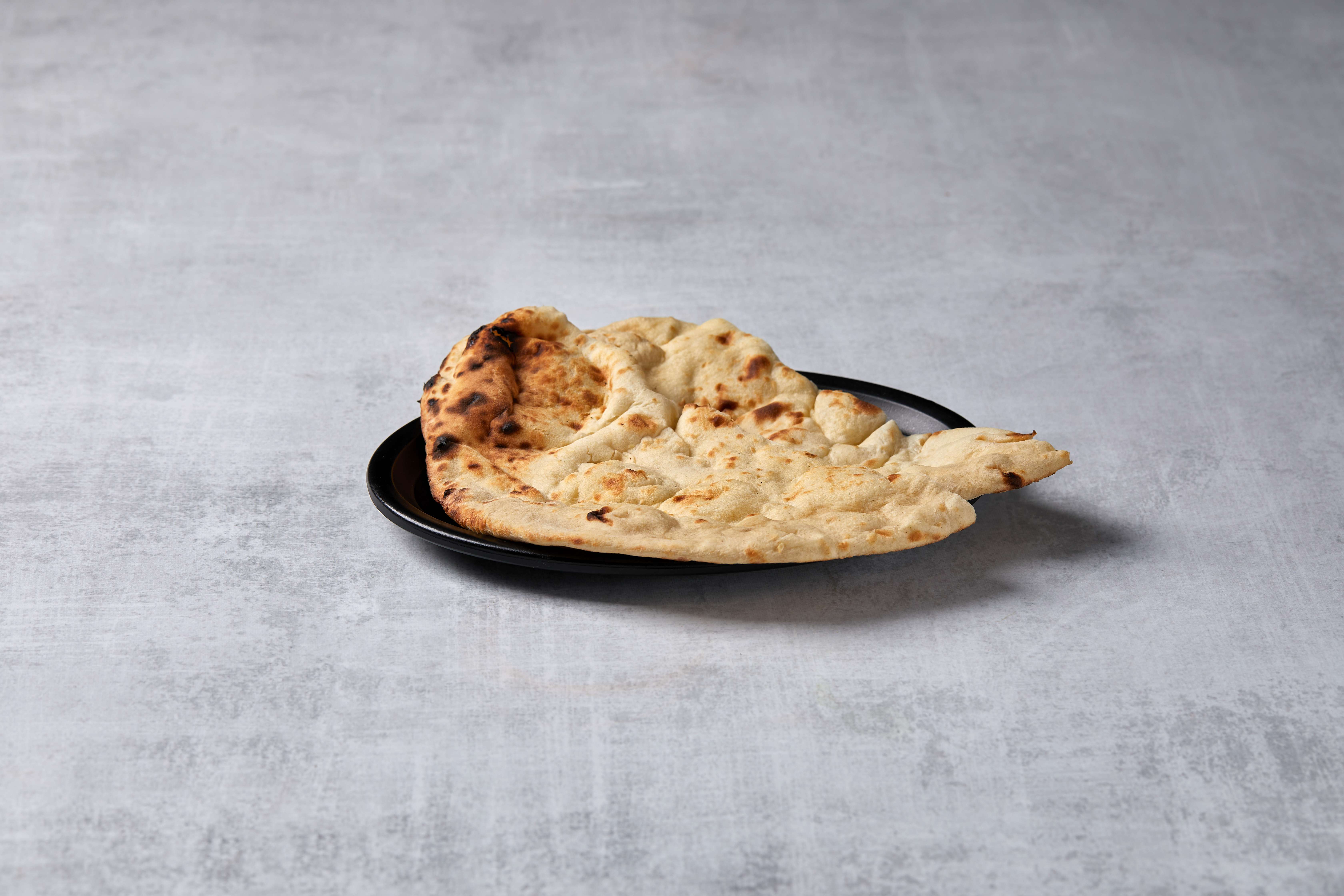 Order Naan food online from Kamal Palace Cuisine of India store, Long Beach on bringmethat.com
