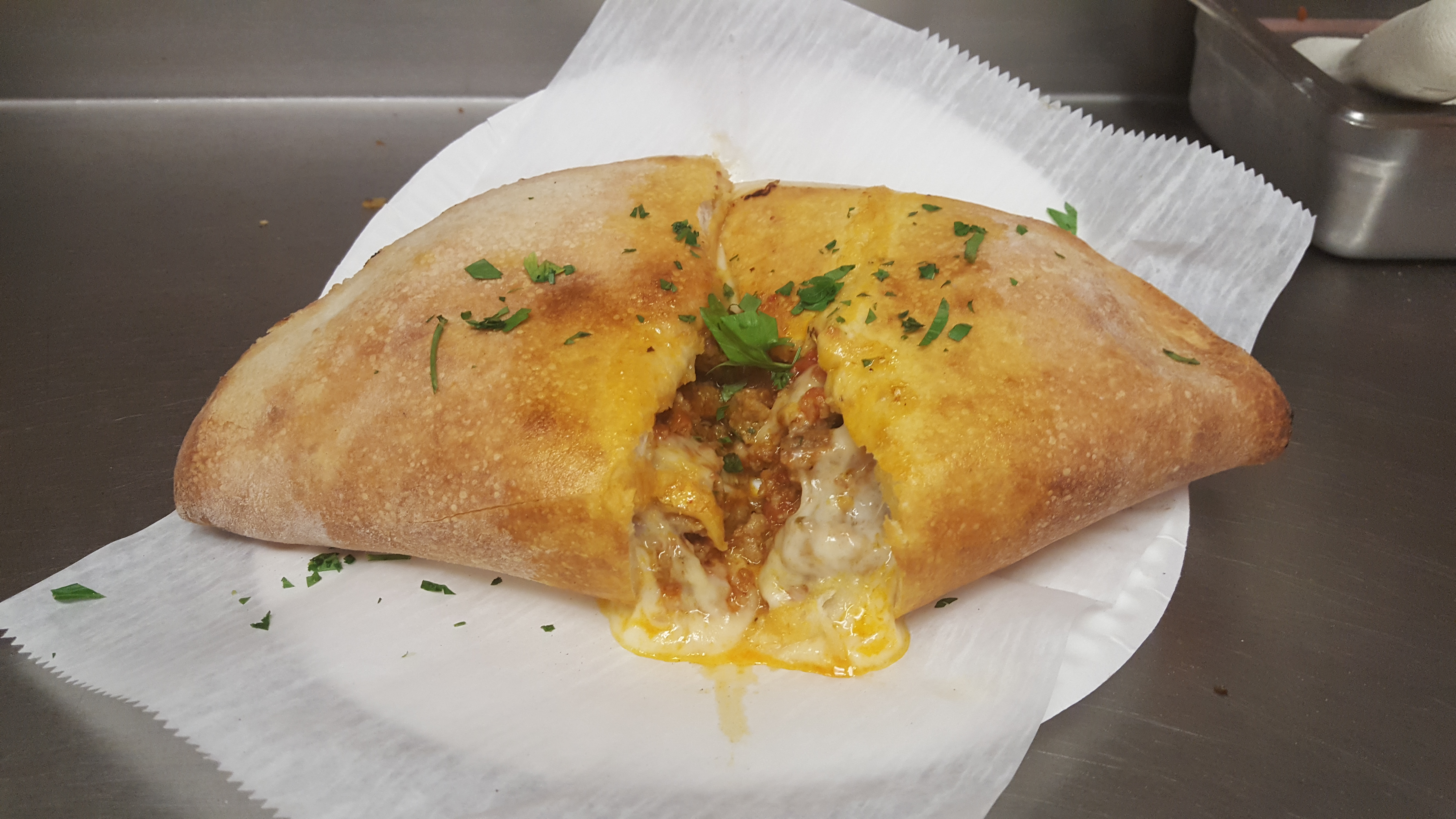 Order Meat and Cheese Calzone food online from Pizzarelli's Pizza store, Scarsdale on bringmethat.com