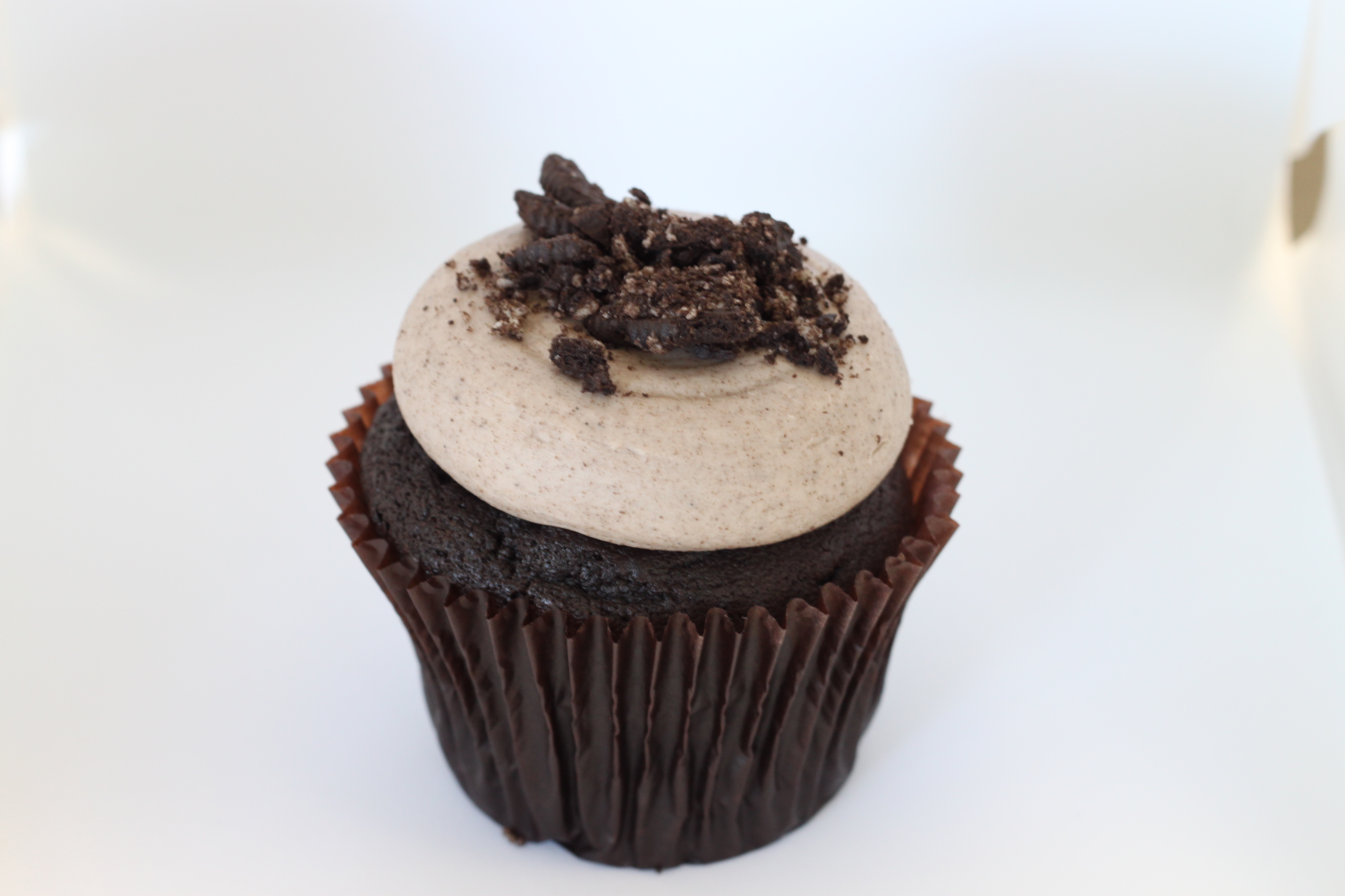 Order Cookies and Cream Cupcake food online from Smallcakes Cupcakery And Creamery store, Garhanna on bringmethat.com
