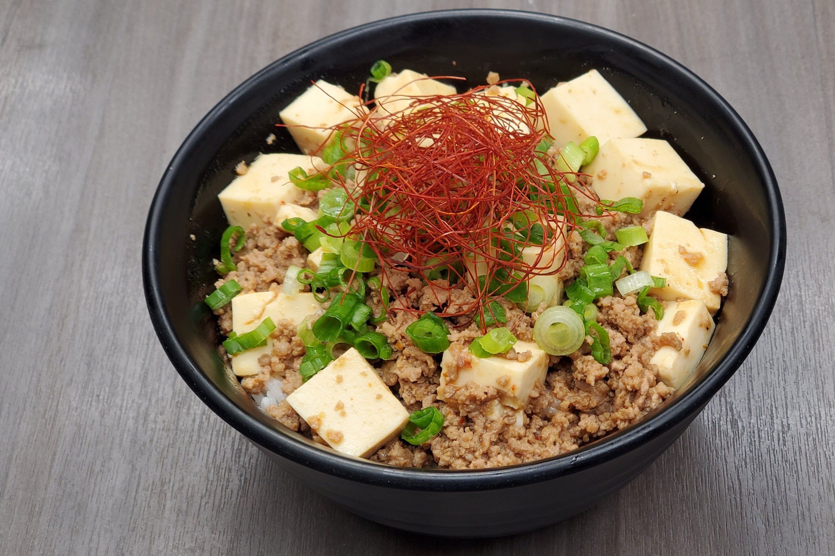 Order Japanese mapo-tofu rice bowl food online from Shin-Sen-Gumi Hakata Ramen - Gardena store, Gardena on bringmethat.com