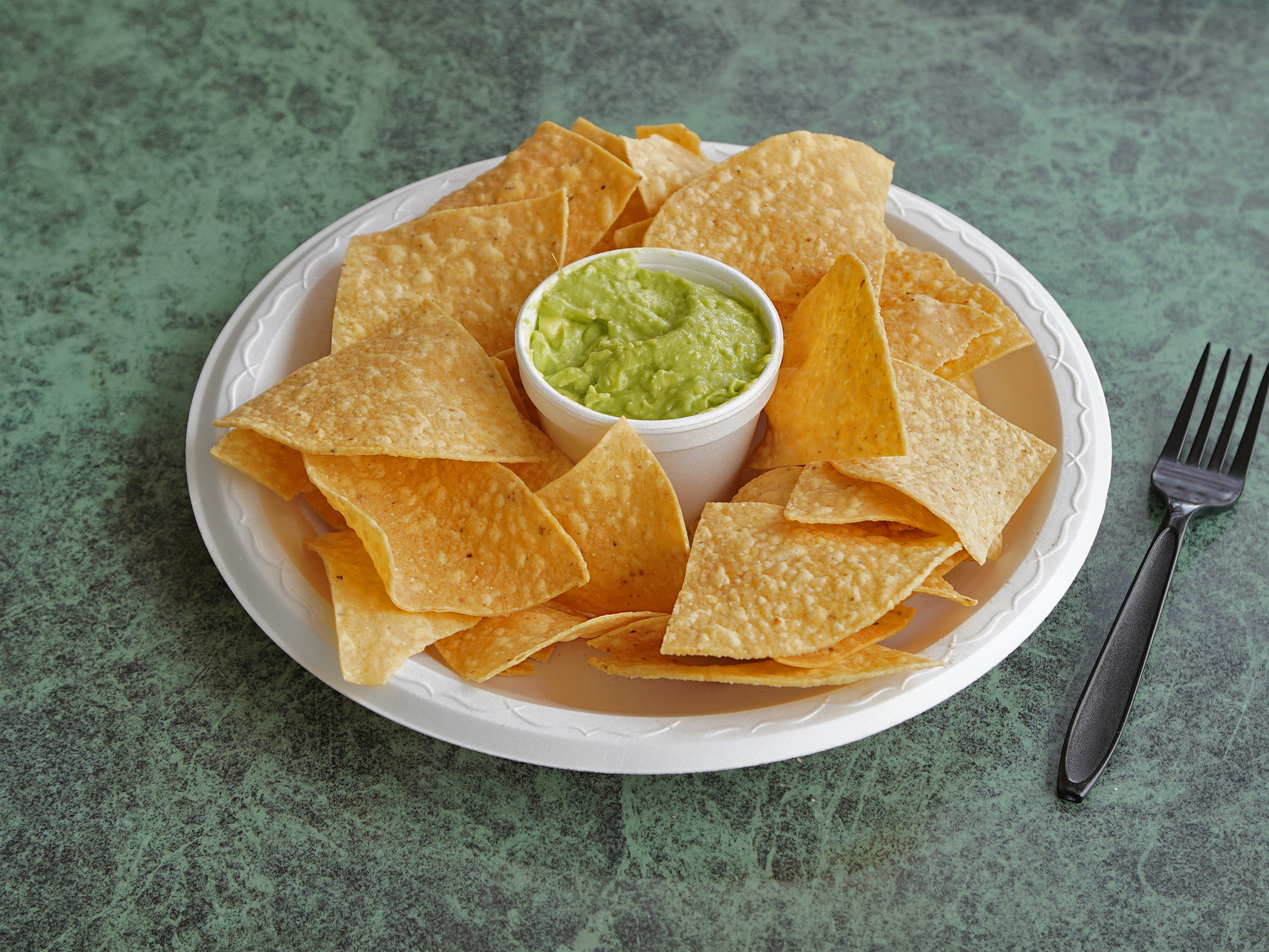 Order Chips and Guacamole (4oz) food online from Cabo Cabana Fresh Baja Grill store, Stevenson Ranch on bringmethat.com