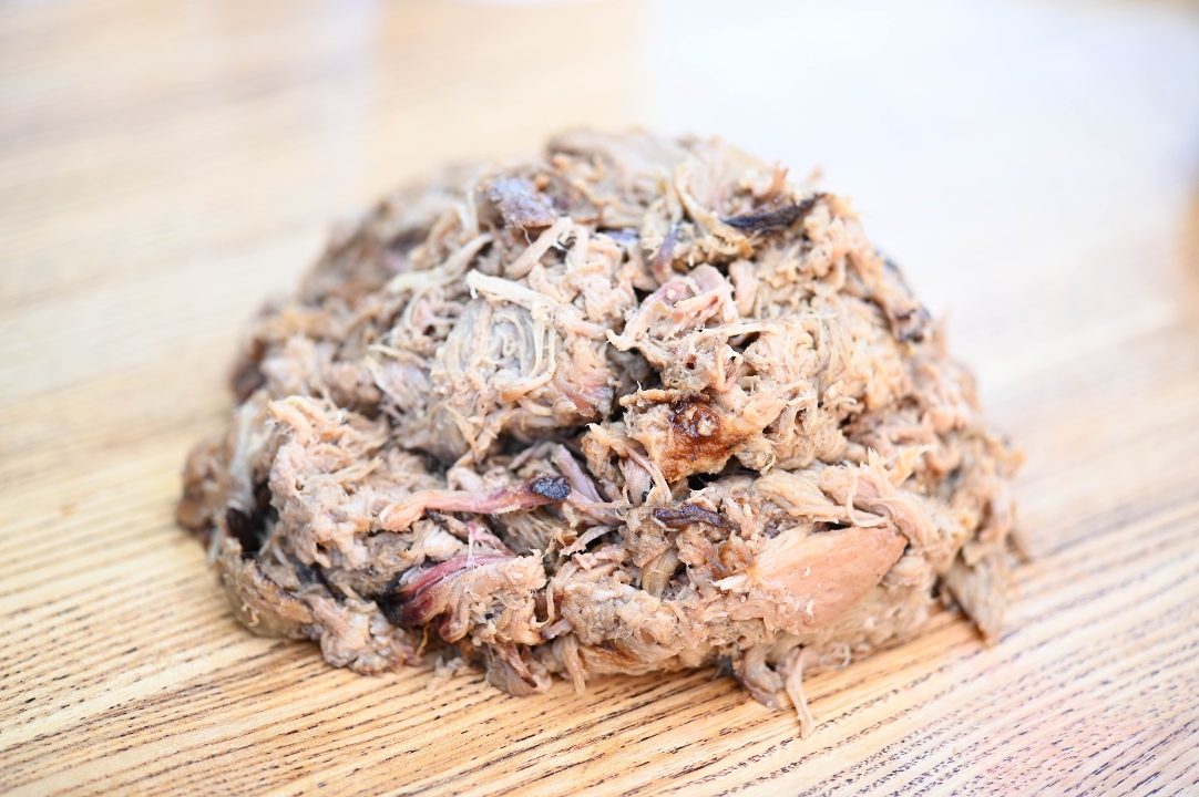 Order 1/2lb Pulled Pork food online from Blu's Barbeque & Bbq Catering store, Dallas on bringmethat.com