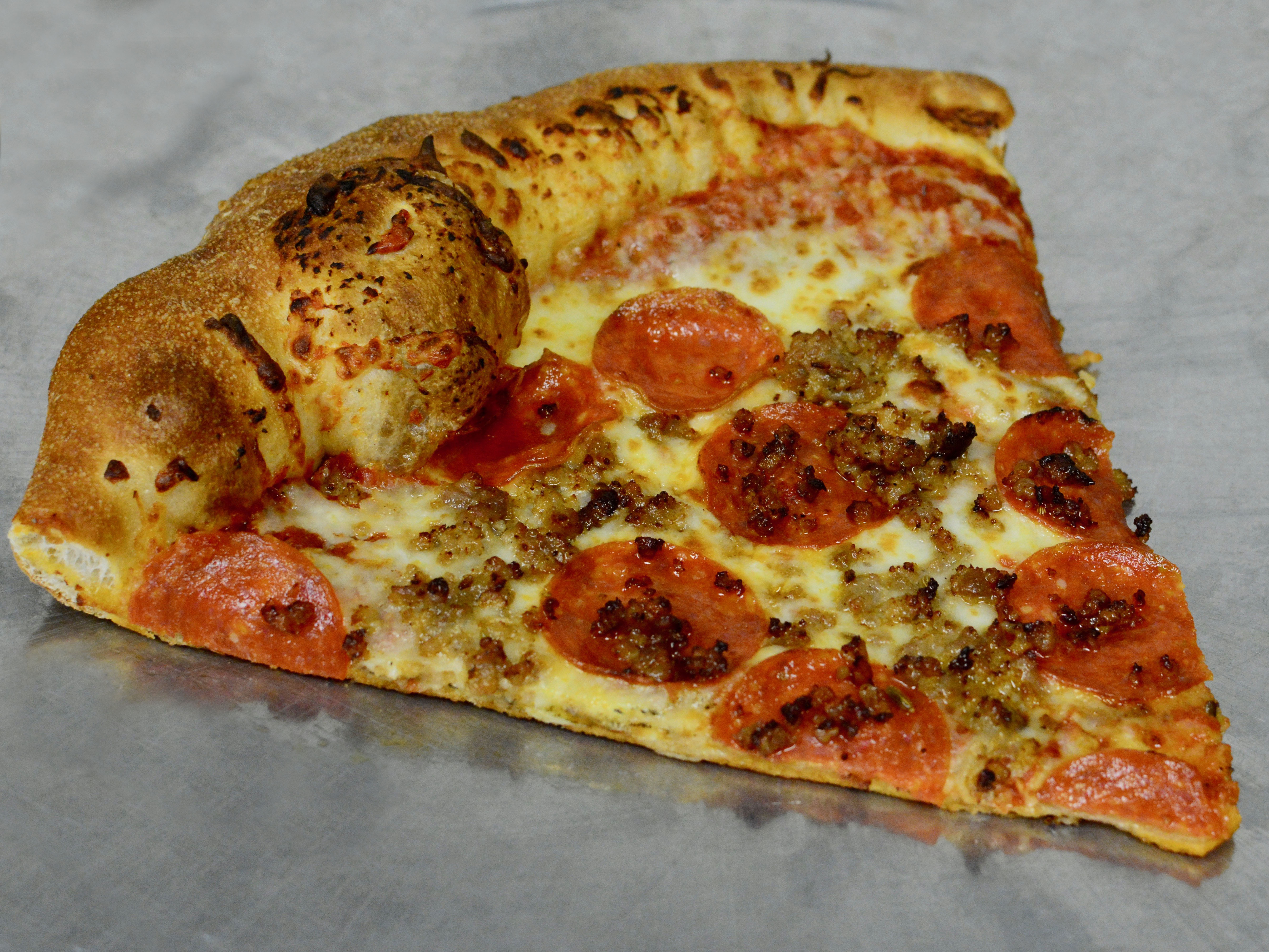 Order NY Pepperoni and Sausage Pizza Slice food online from Mamma Ilardo's Pizzeria store, Washington on bringmethat.com