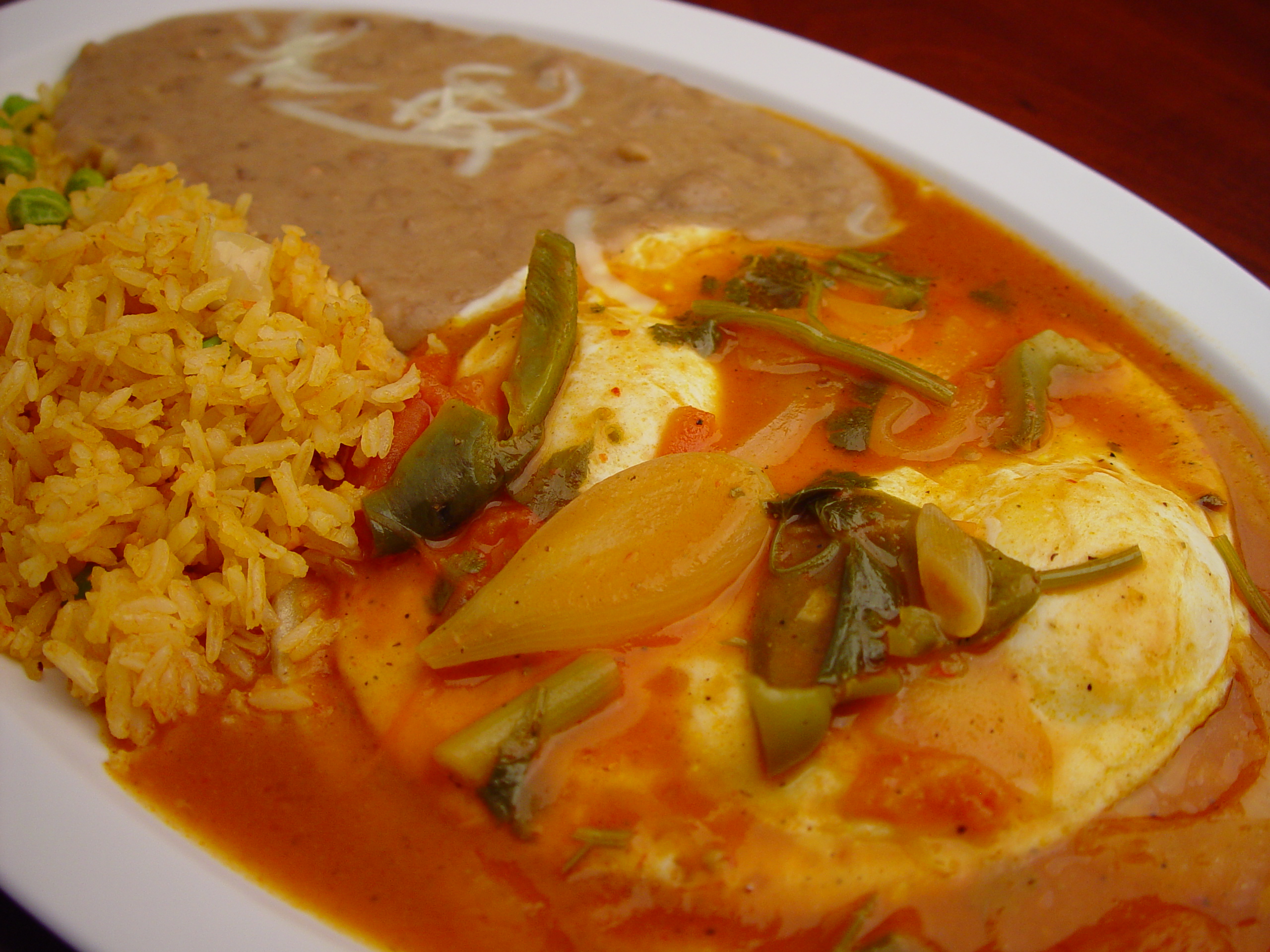 Order 10. Huevos Rancheros food online from Rodeo Mexican Grill store, Los Angeles on bringmethat.com