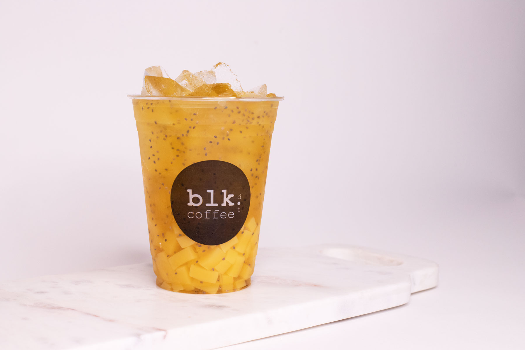 Order Iced Mango Delight GreenTea food online from Blk Dot Coffee store, Irvine on bringmethat.com