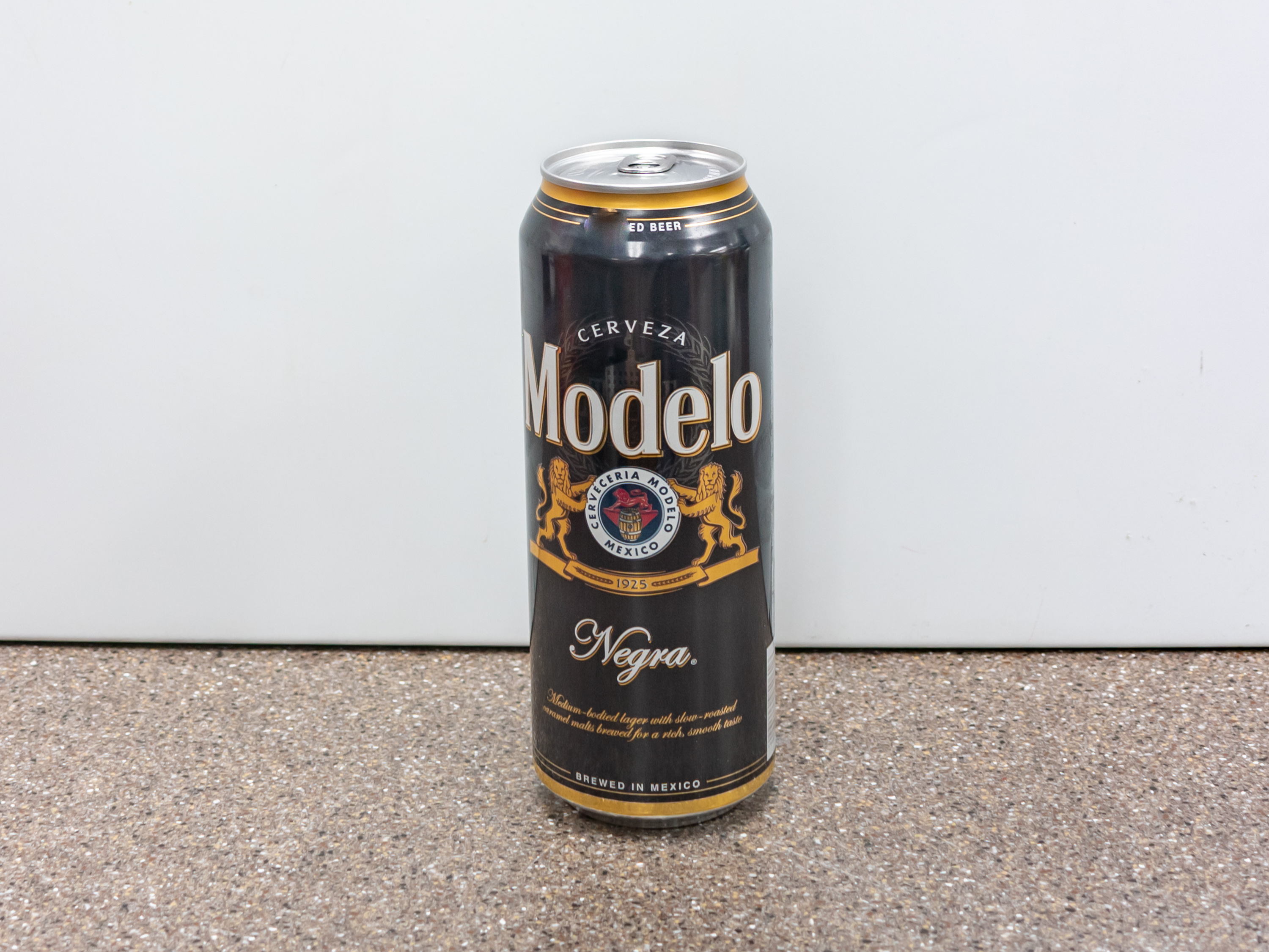Order Modelo Negra Beer, 24 oz. Can  food online from Kangaroo Food Mart store, Cathedral City on bringmethat.com