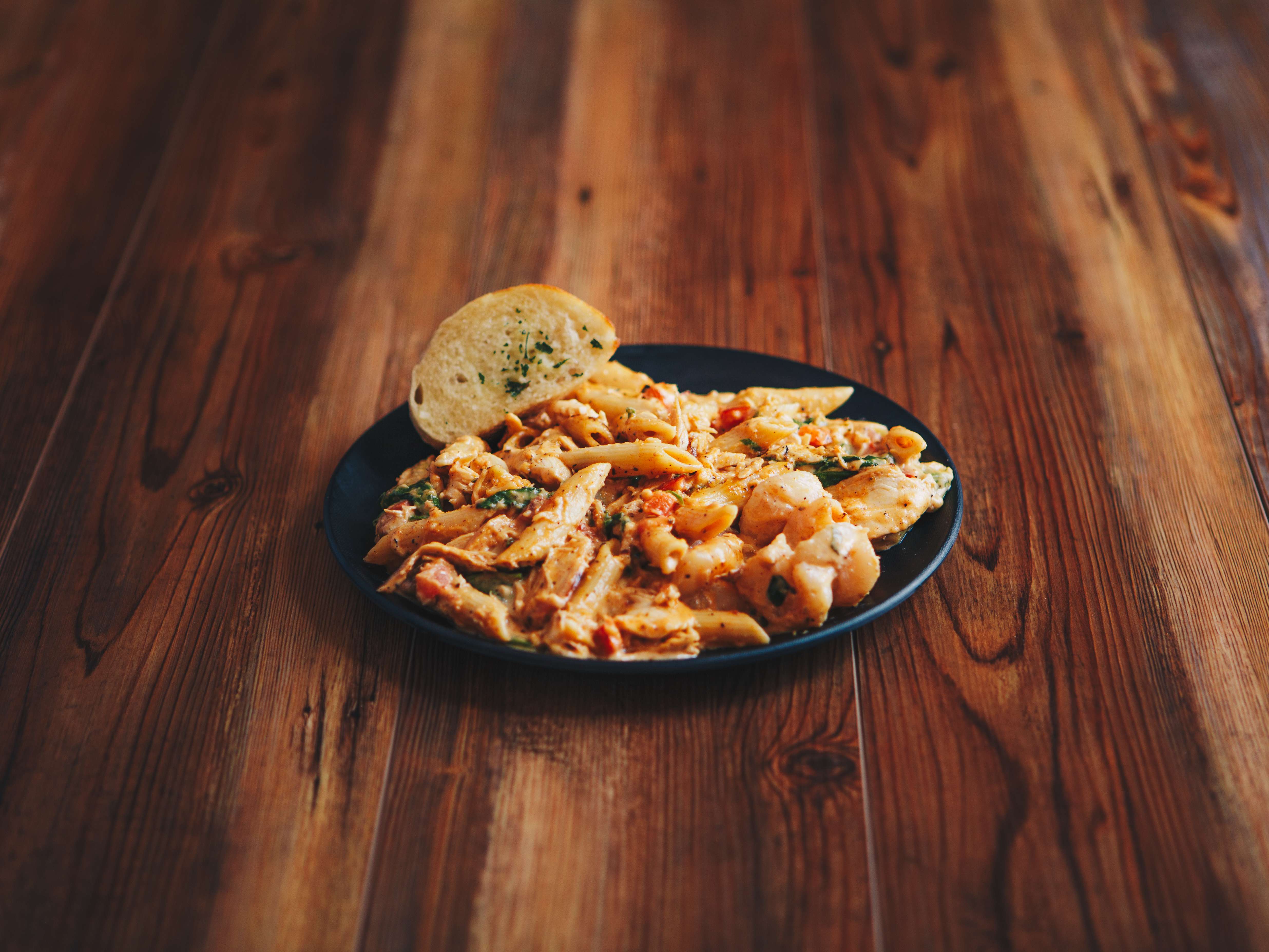 Order Cajun Chicken and Shrimp Pasta food online from The Brass Rail store, Dallas on bringmethat.com