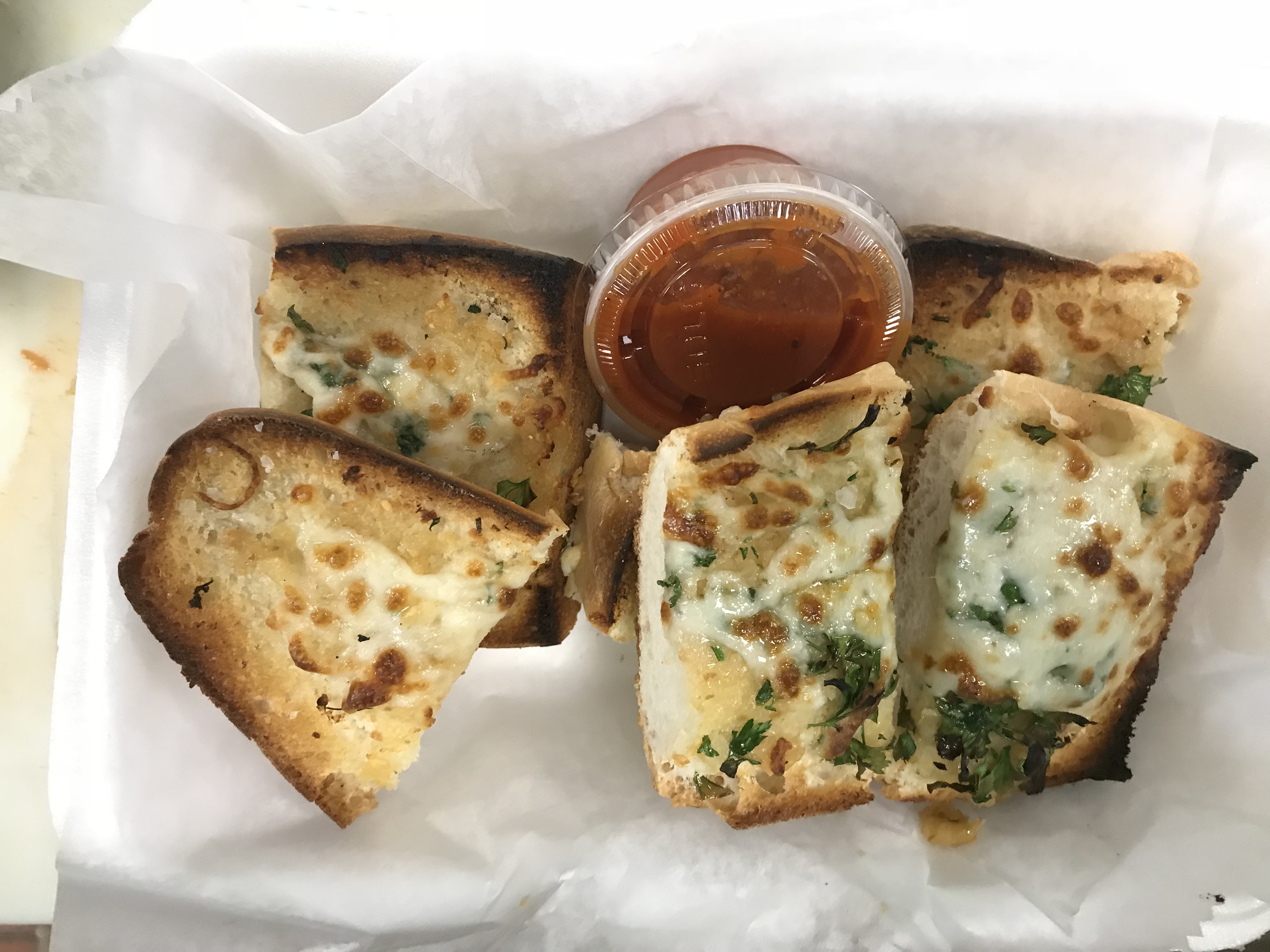 Order Garlic Bread with Cheese and Side of Marinara food online from Napolitano's Brooklyn Pizza store, Cranston on bringmethat.com