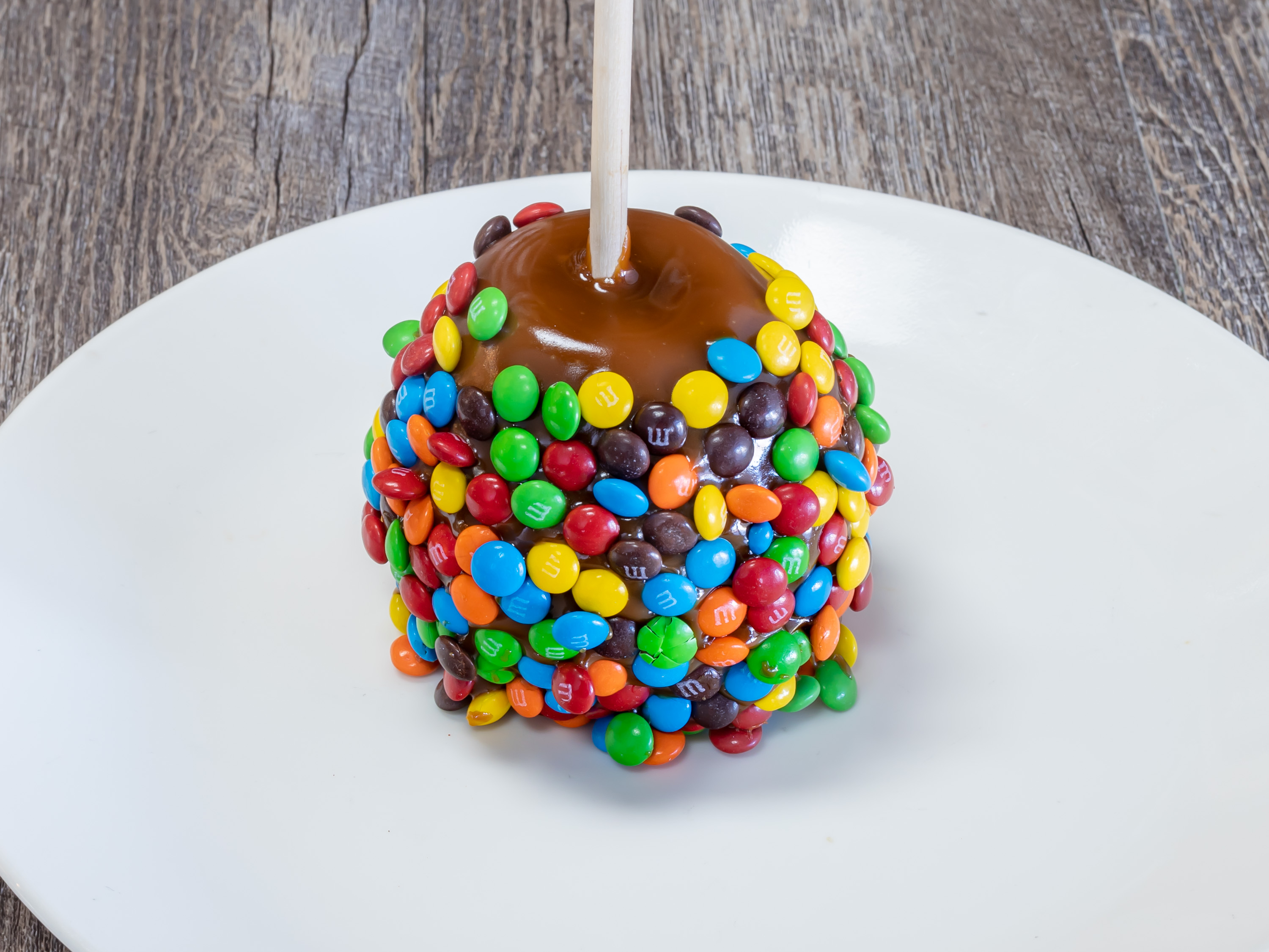 Order M & M Apple food online from Rocky Mountain Chocolate Factory store, Houston on bringmethat.com