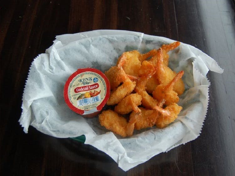 Order Shrimp Basket - 12 Pieces food online from Claymont Steak Shop store, Claymont on bringmethat.com