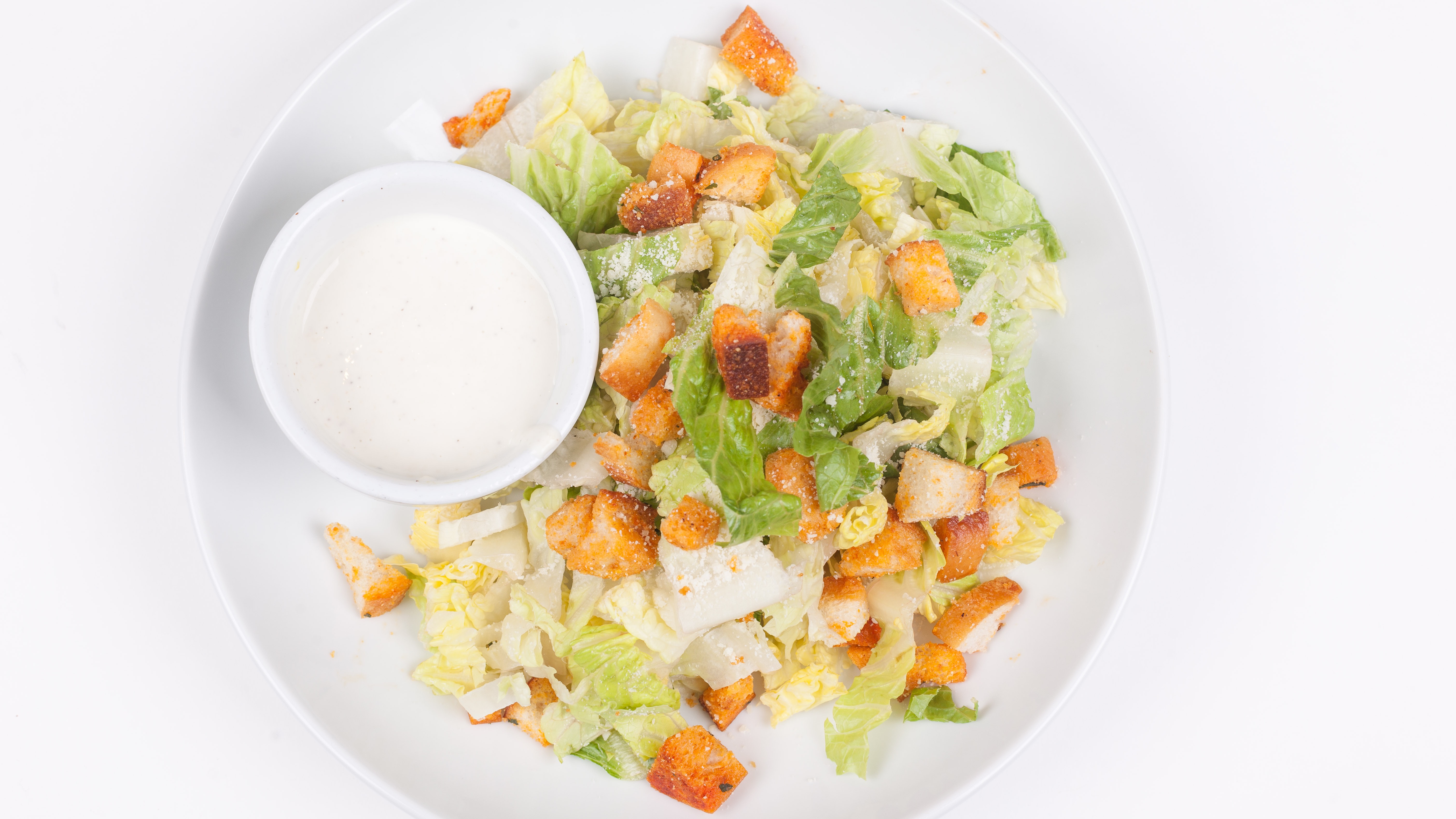 Order Caesar Salad food online from Umberto's Pizzeria store, New Hyde Park on bringmethat.com
