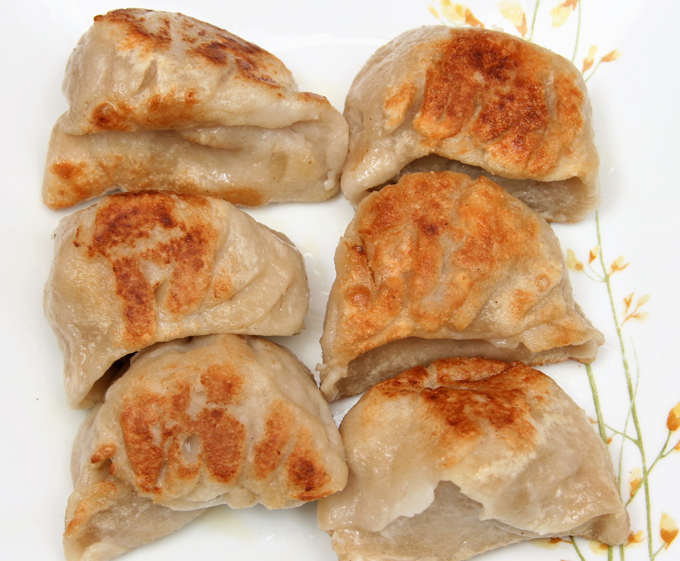 Order 6 Pieces Pot Stickers food online from Hong KONG Express store, Chicago on bringmethat.com