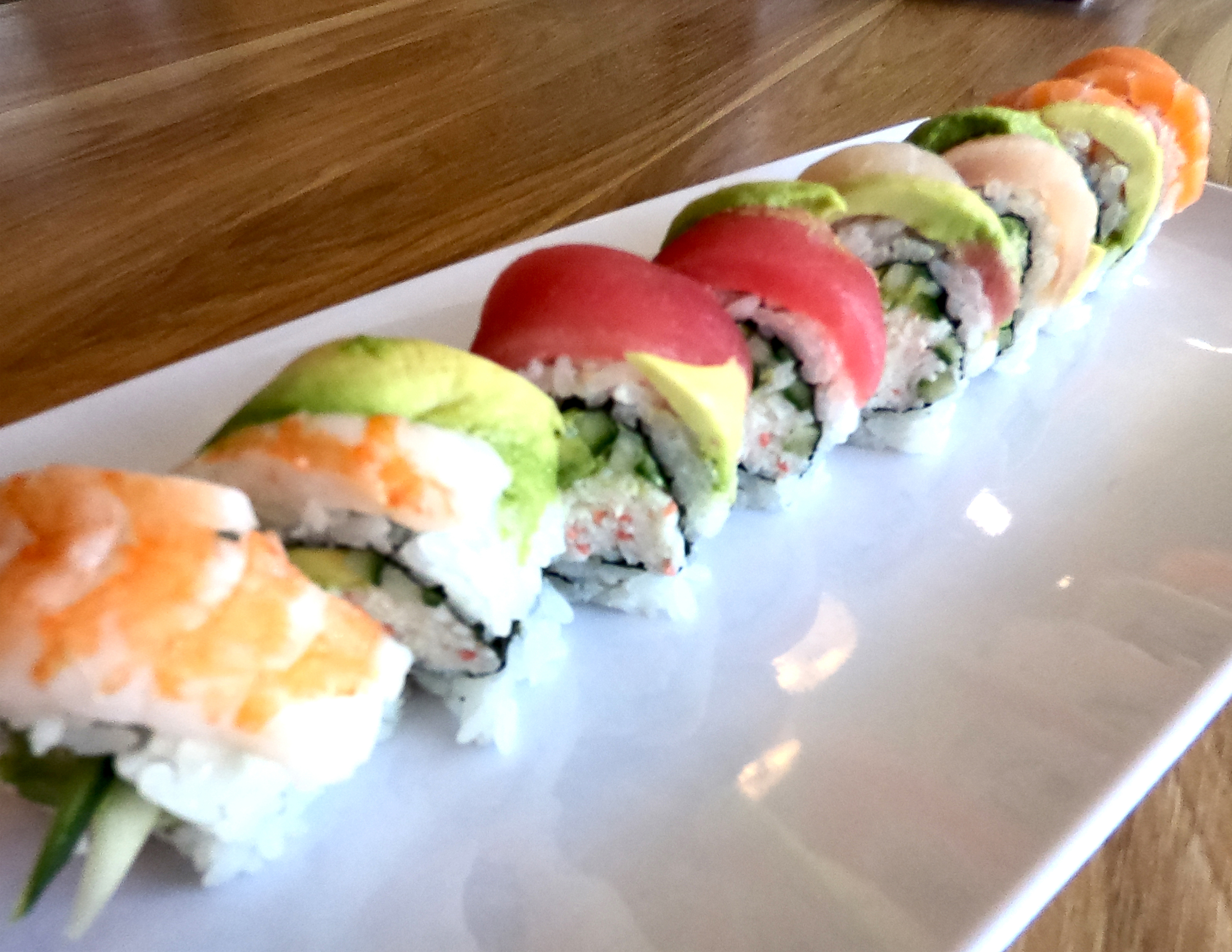 Order Rainbow Roll food online from Rollstop Sushi store, San Pedro on bringmethat.com