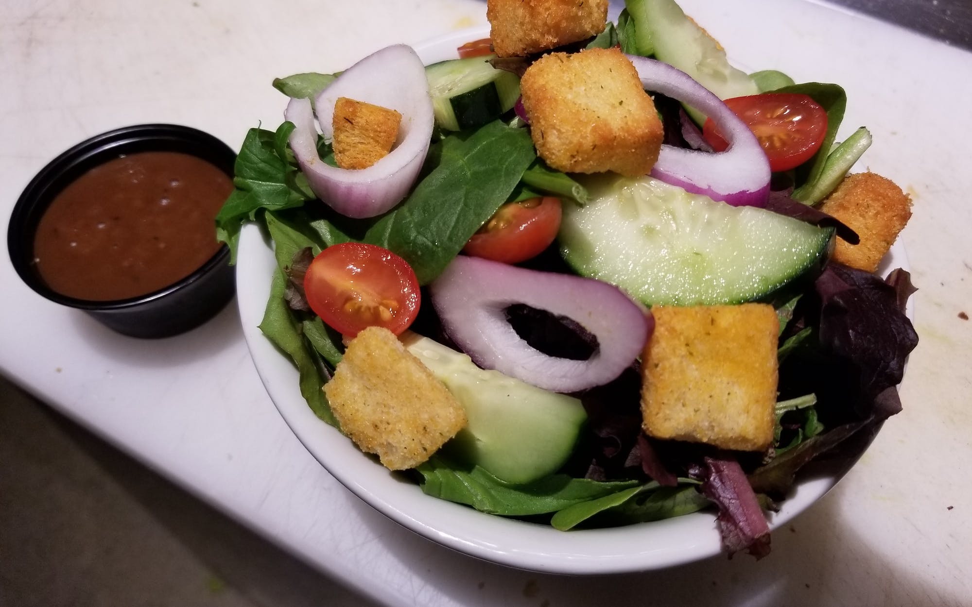 Order Garden Salad - Side food online from Schmizza Pub & Grub store, Portland on bringmethat.com