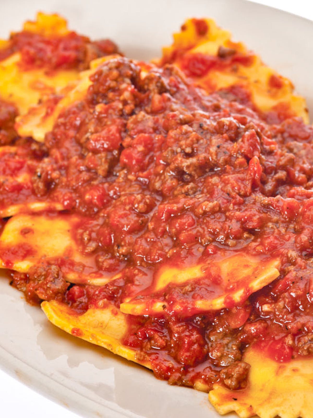 Order Ravioli with Meat Sauce - Small (Serves 3 People) food online from Buca di Beppo store, Austin on bringmethat.com