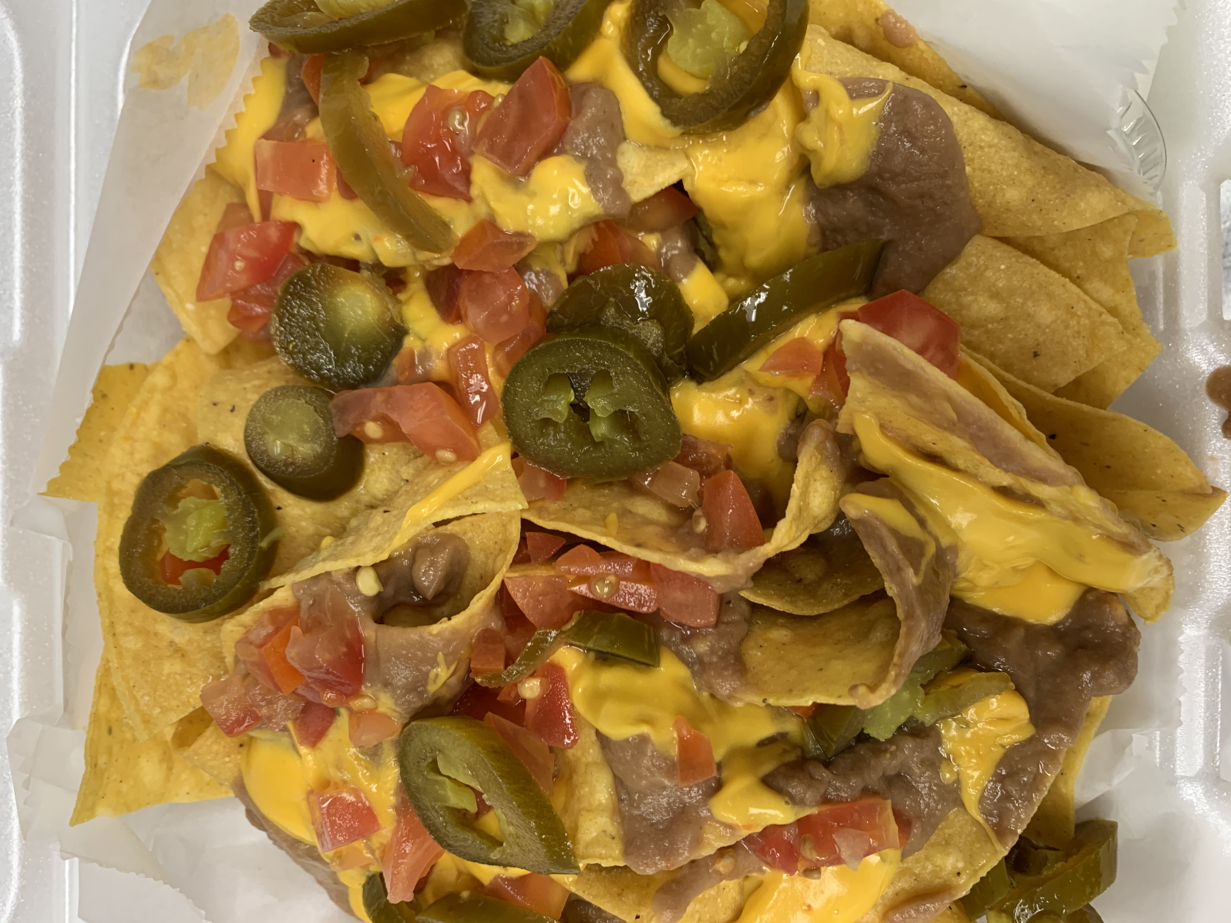 Order Nachos food online from 1st Place Sports Bar store, Hoffman Estates on bringmethat.com