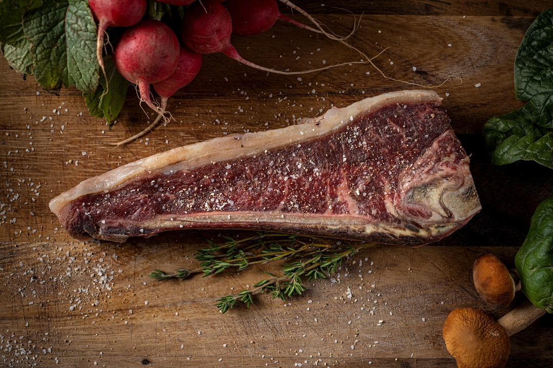 Order Dry Aged Bone in Strip food online from Publican Quality Meats store, Chicago on bringmethat.com