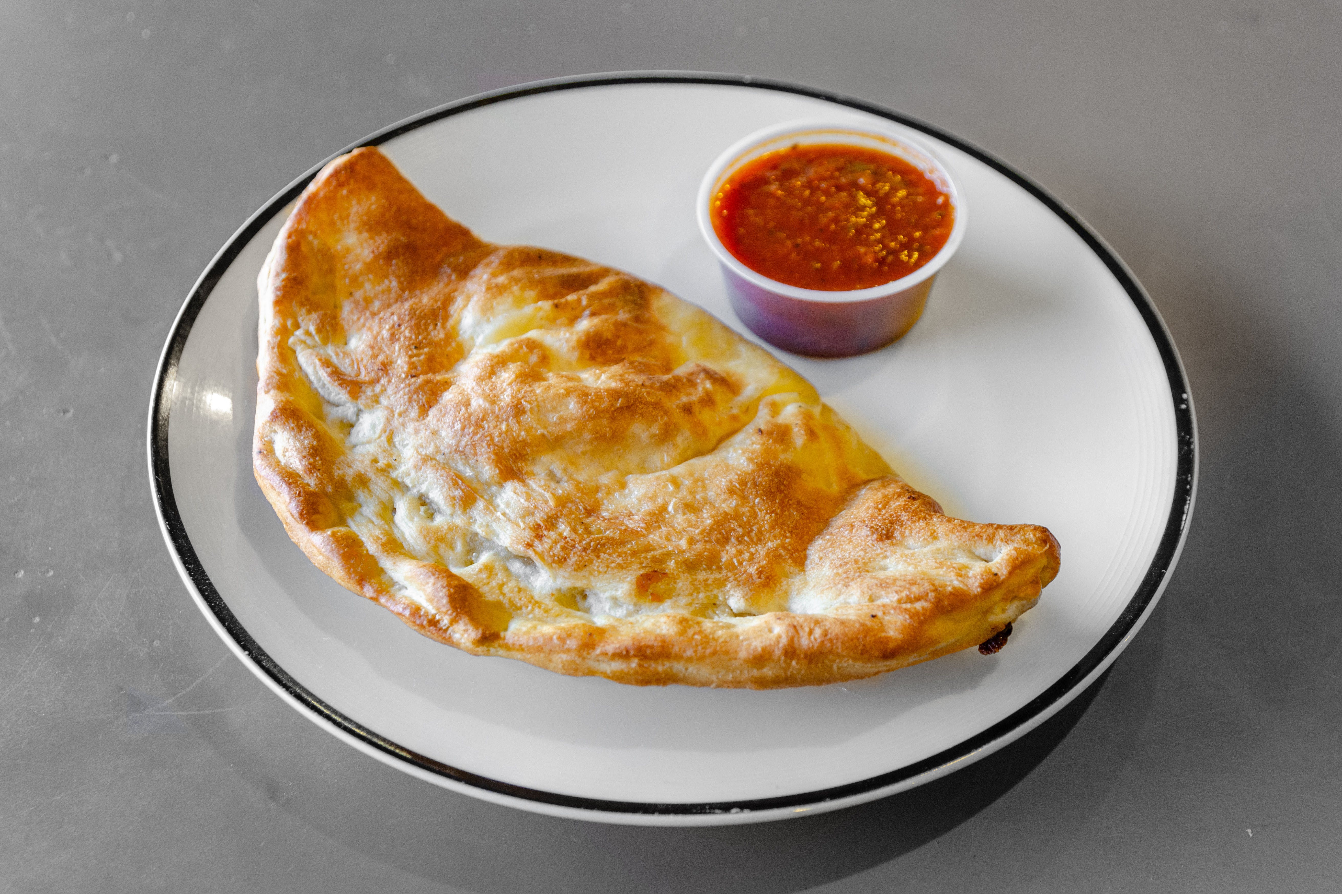 Order Cheese Calzone - Calzone food online from Piazza pizza store, Astoria on bringmethat.com