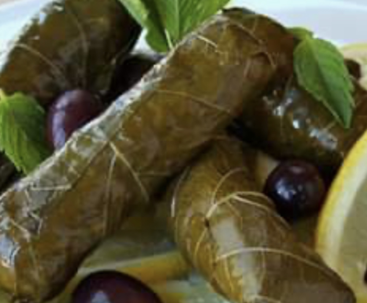 Order 4 Grape Leaf Rolls food online from It's Greek To Me store, Joplin on bringmethat.com