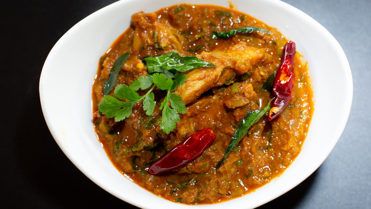 Order Spicy Chicken Curry food online from Masala Desi Cafe store, Burlingame on bringmethat.com